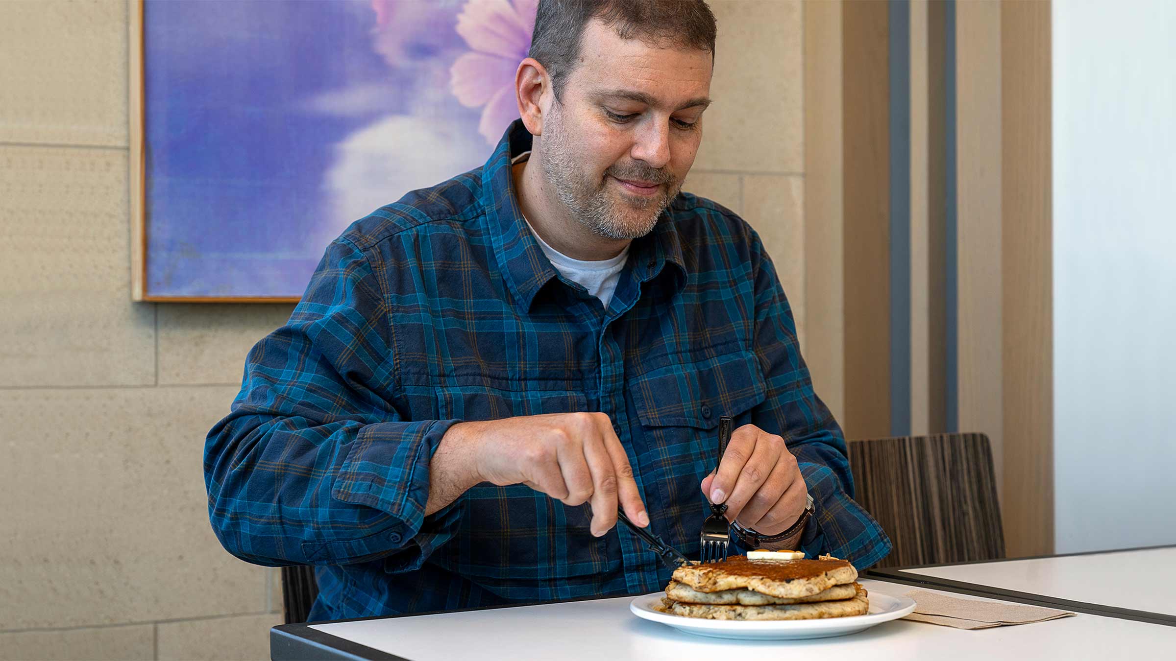 Todd Burnworth eating pancakes at the hospital cafe