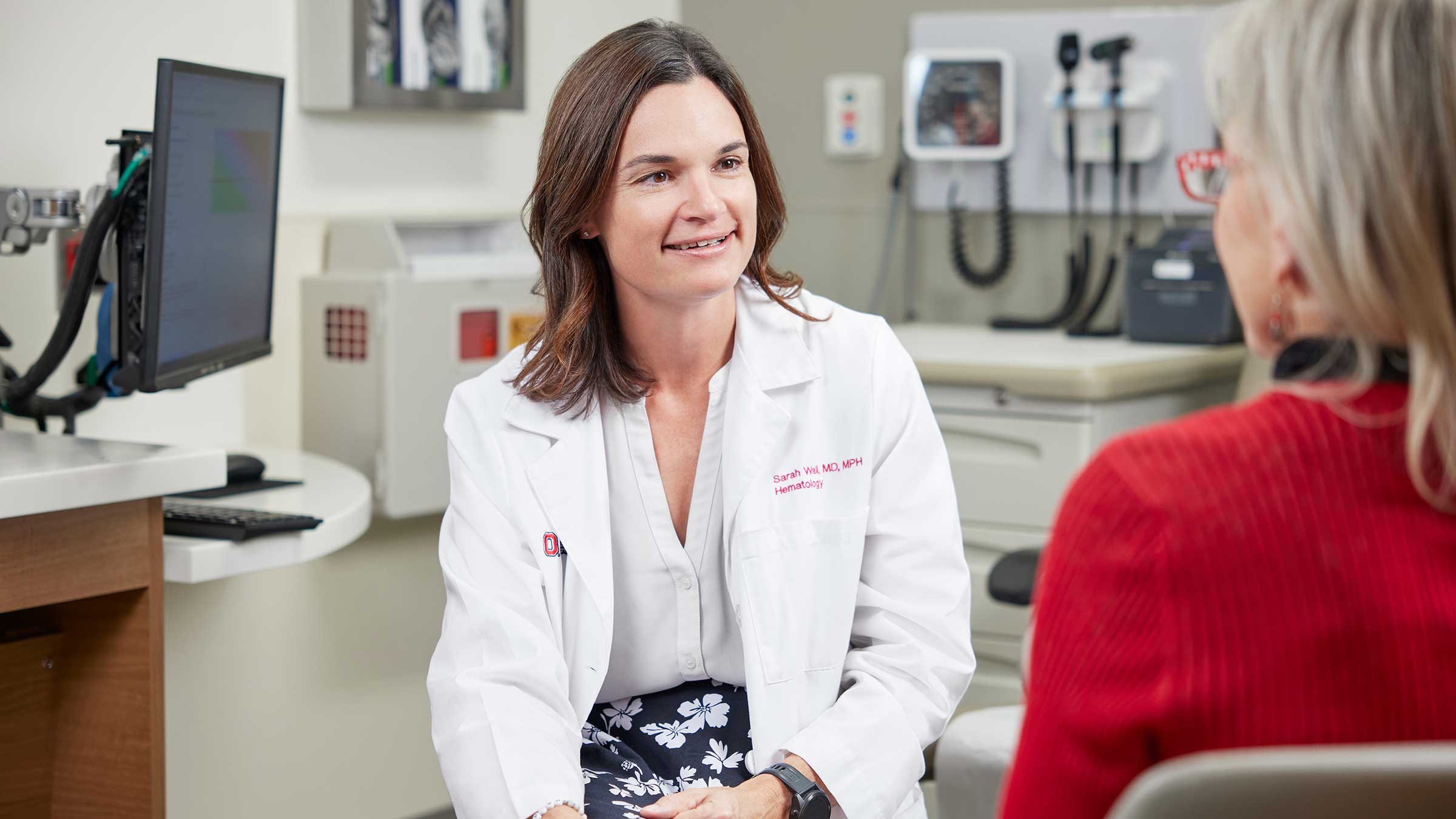 Dr. Wall talking to a patient