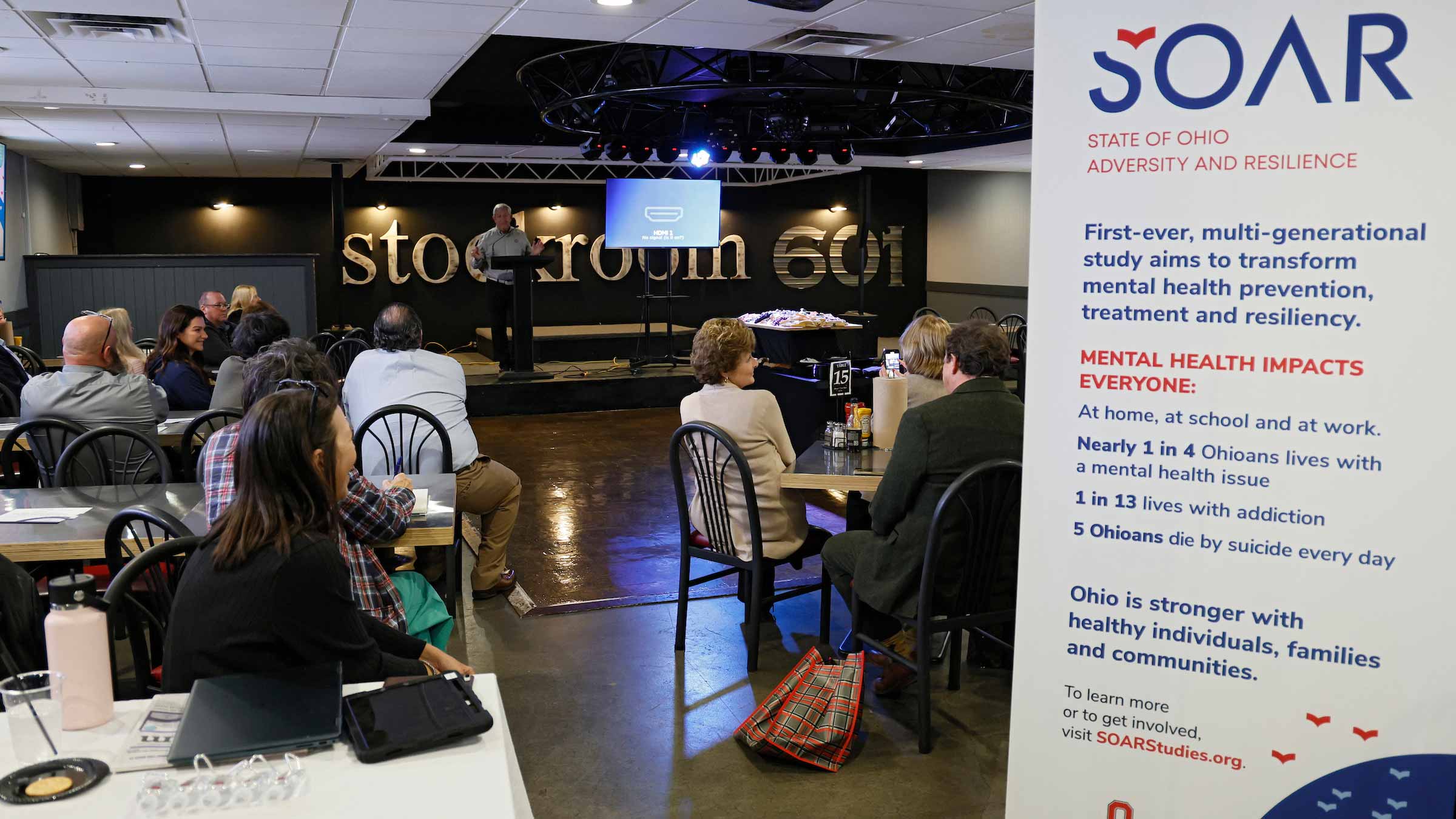 A banner explaining the SOAR study in the room of attendees