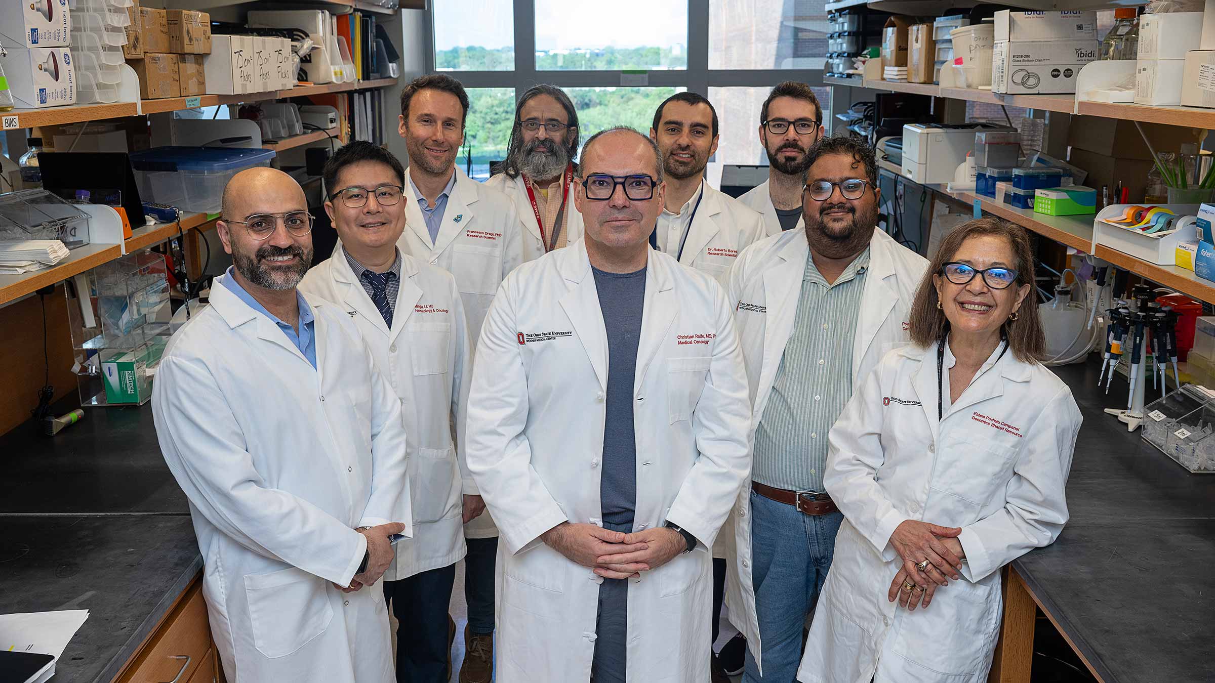 Dr. Christian Rolfo and his medical team in a lab setting