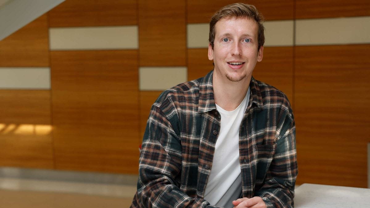 Transplant patient, Kyle Clark, in a medical lobby