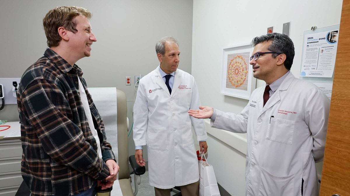 Transplant patient, Kyle Clark, speaking with Dr. Bezerra and Dr. Pesavento