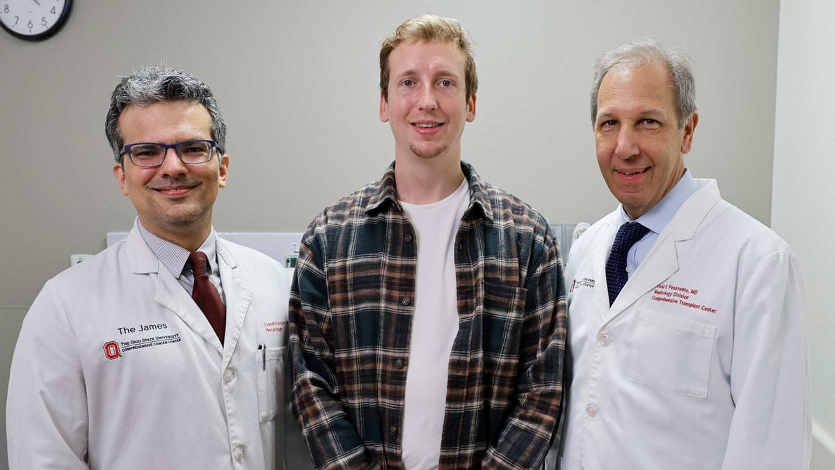 Transplant patient, Kyle Clark, standing with Dr. Bezerra and Dr. Pesavento for a photo