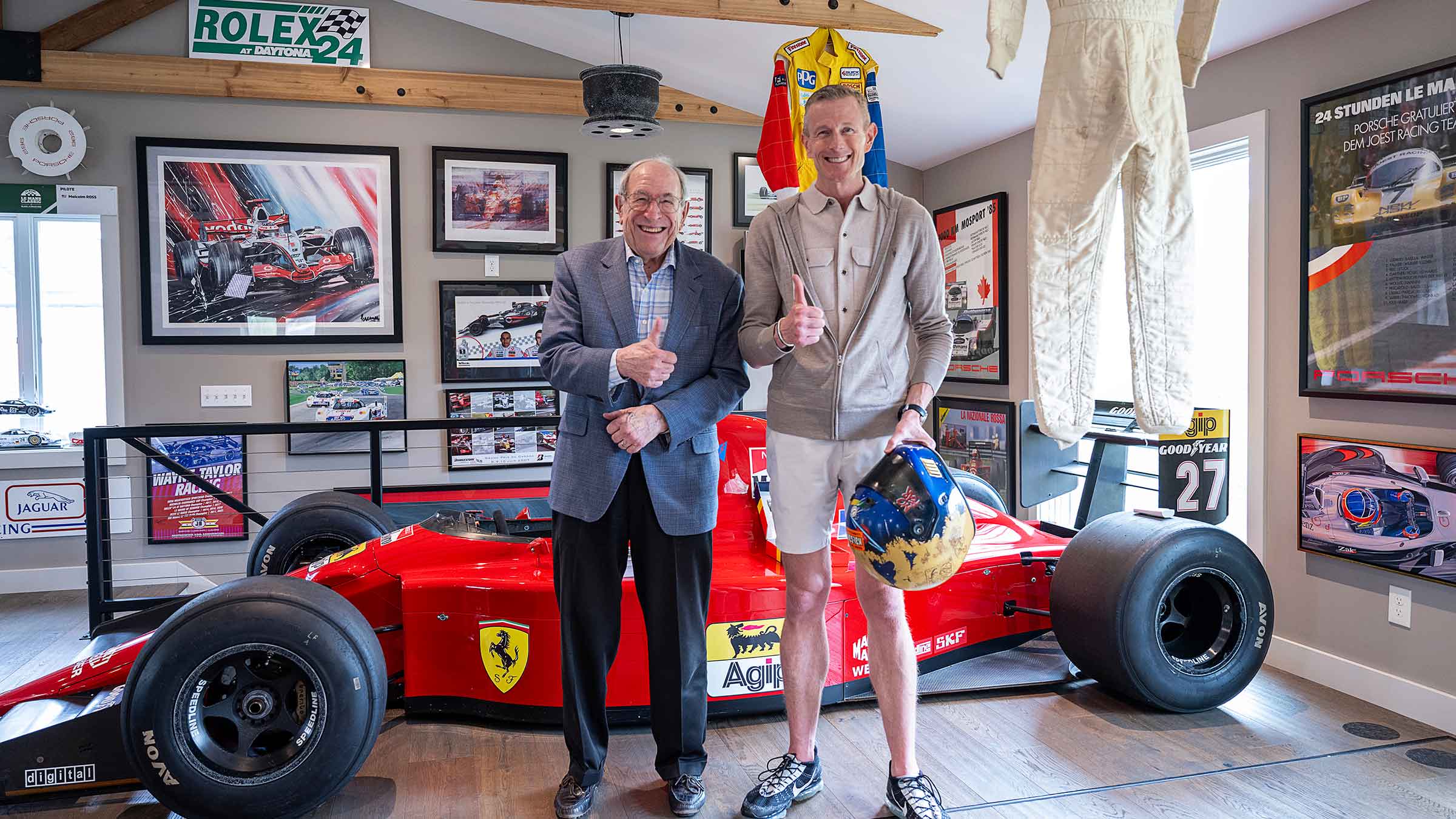 Stan Ross with his son, Malcolm, next to a race car
