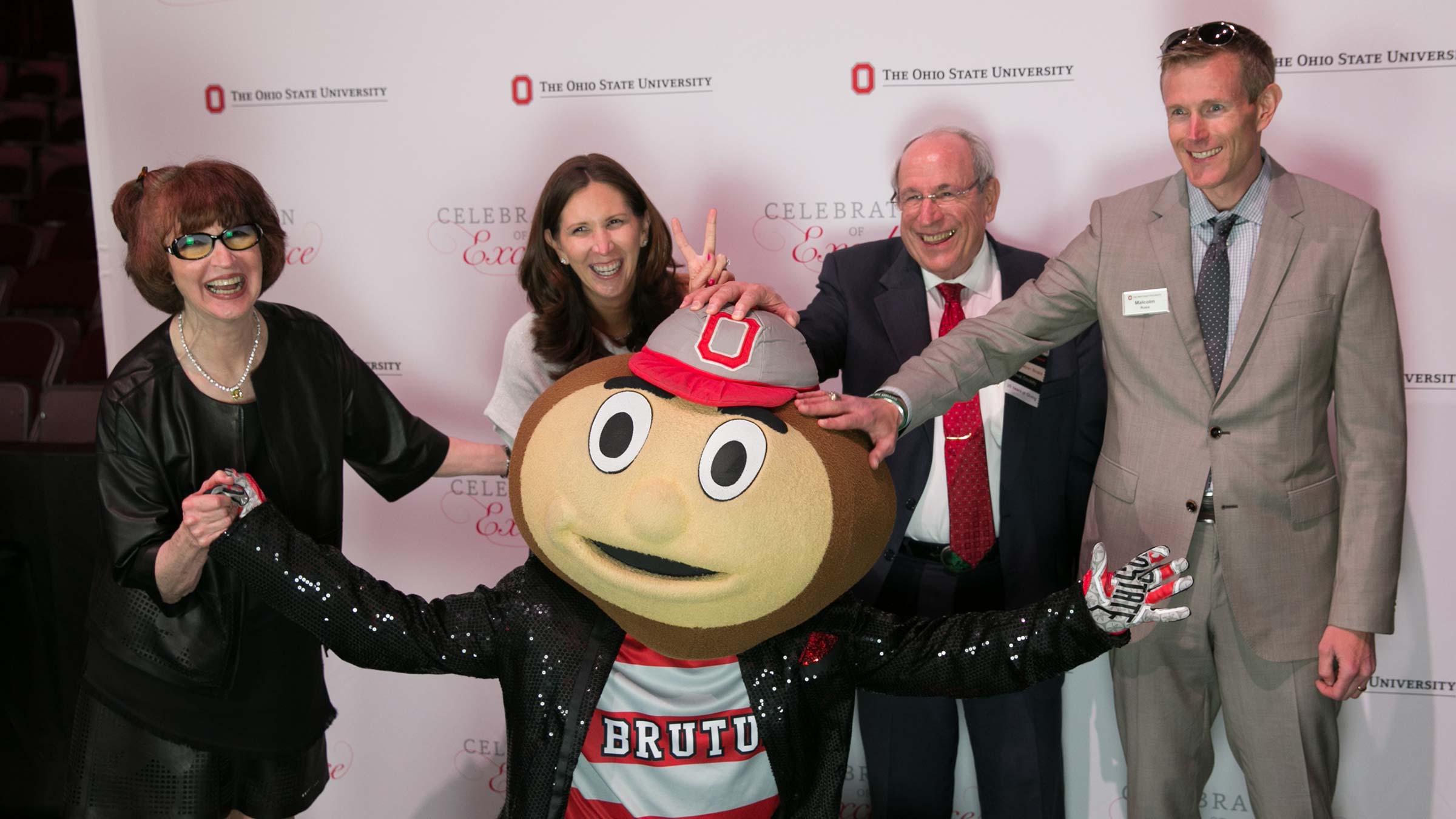 The Ross family posing with Brutus Buckeye