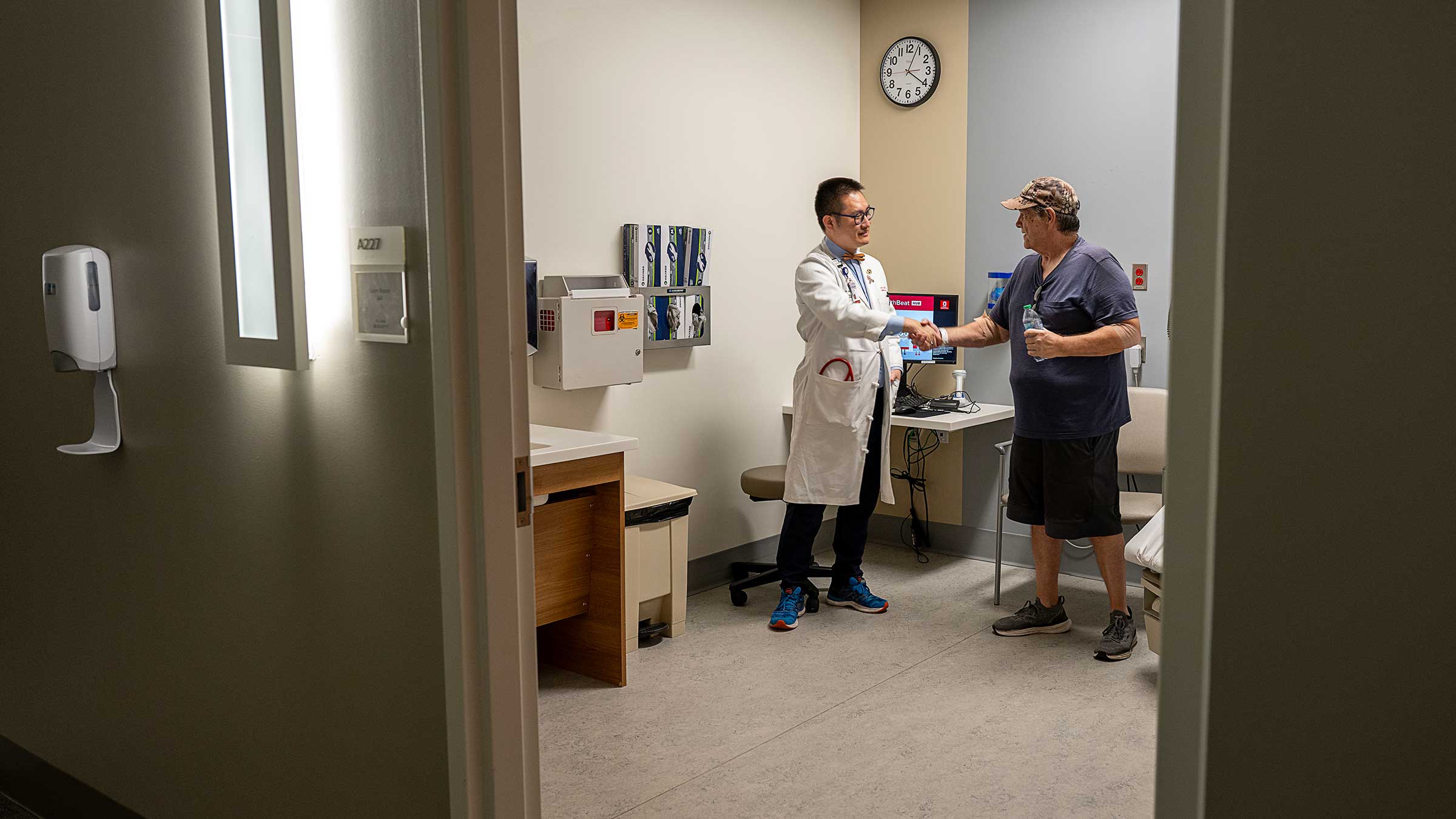 Mike Penrod shaking hands with his doctor