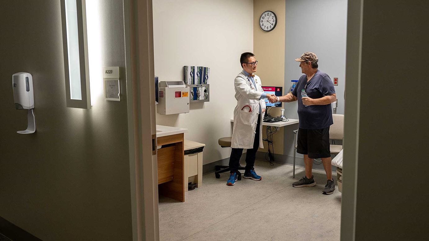 Mike Penrod shaking hands with his doctor