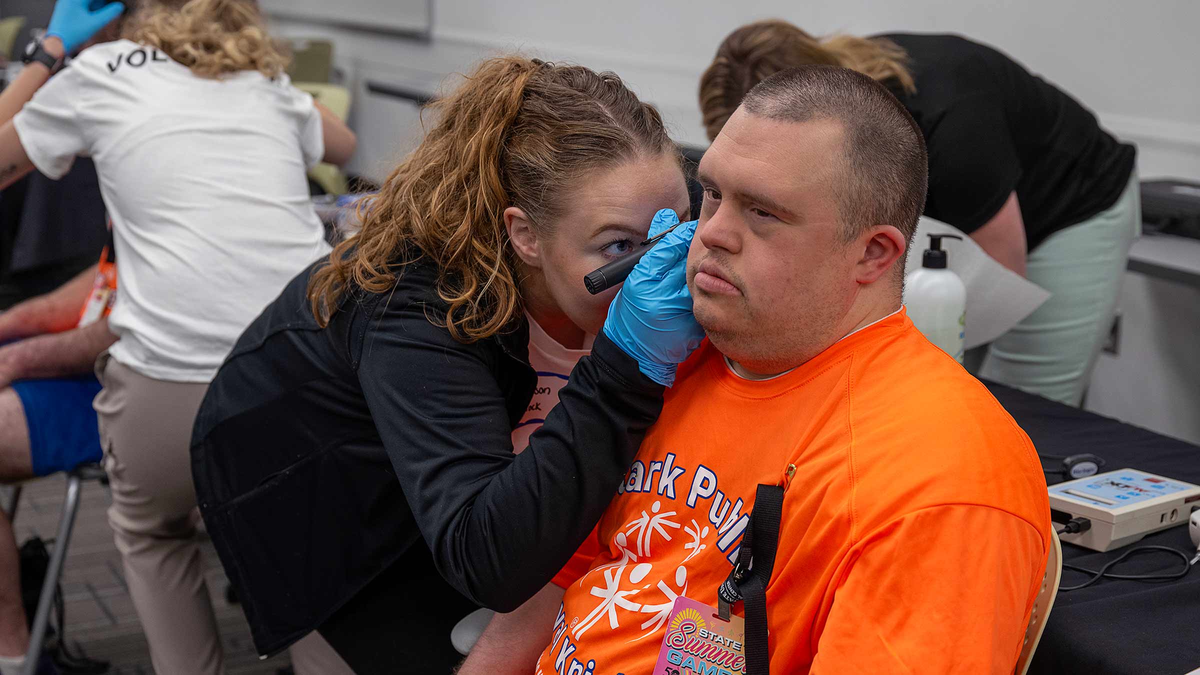Special Olympics participant getting his hearing checked