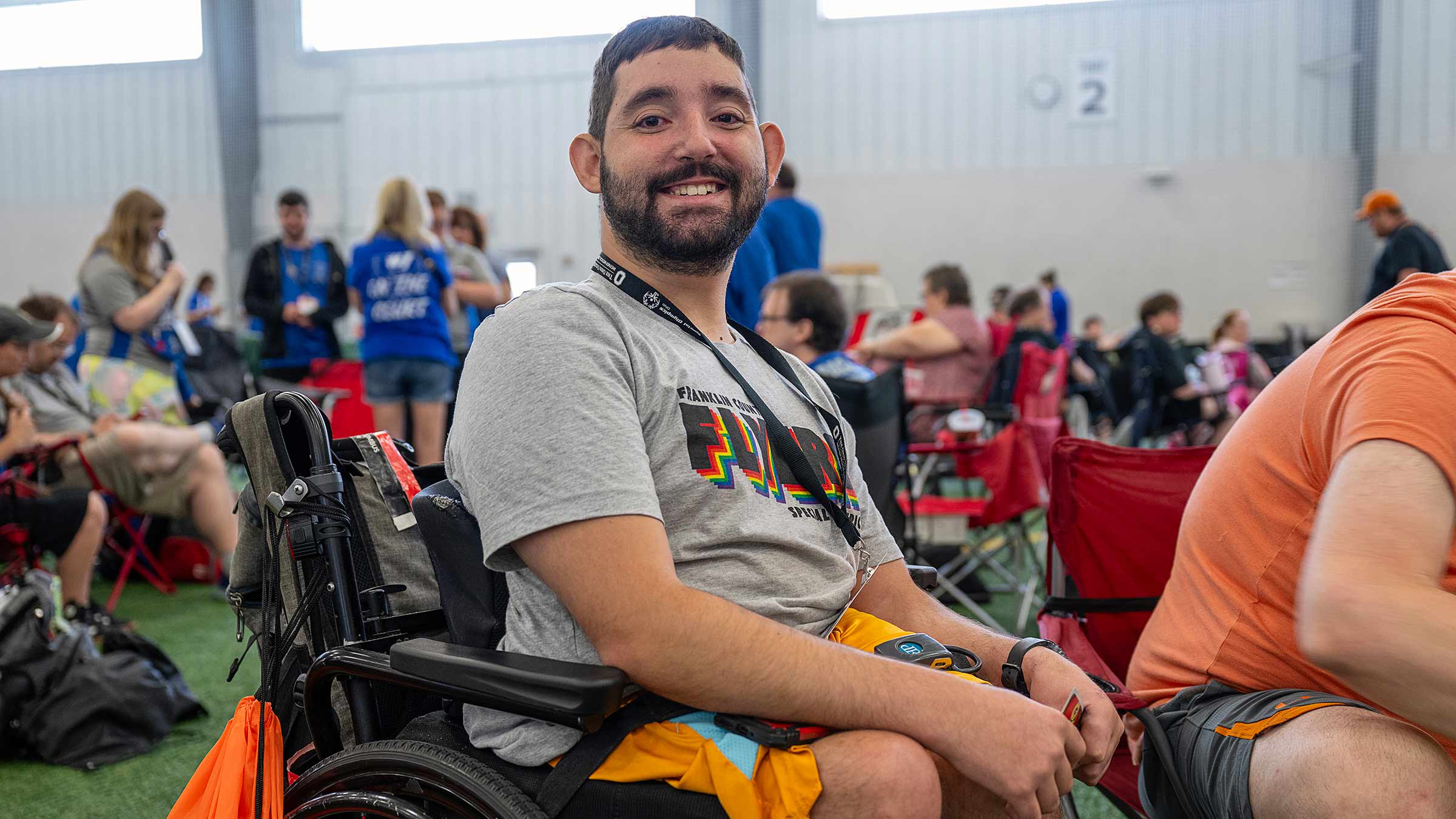 Special Olympics athlete Maxwell Damron, in a wheelchair