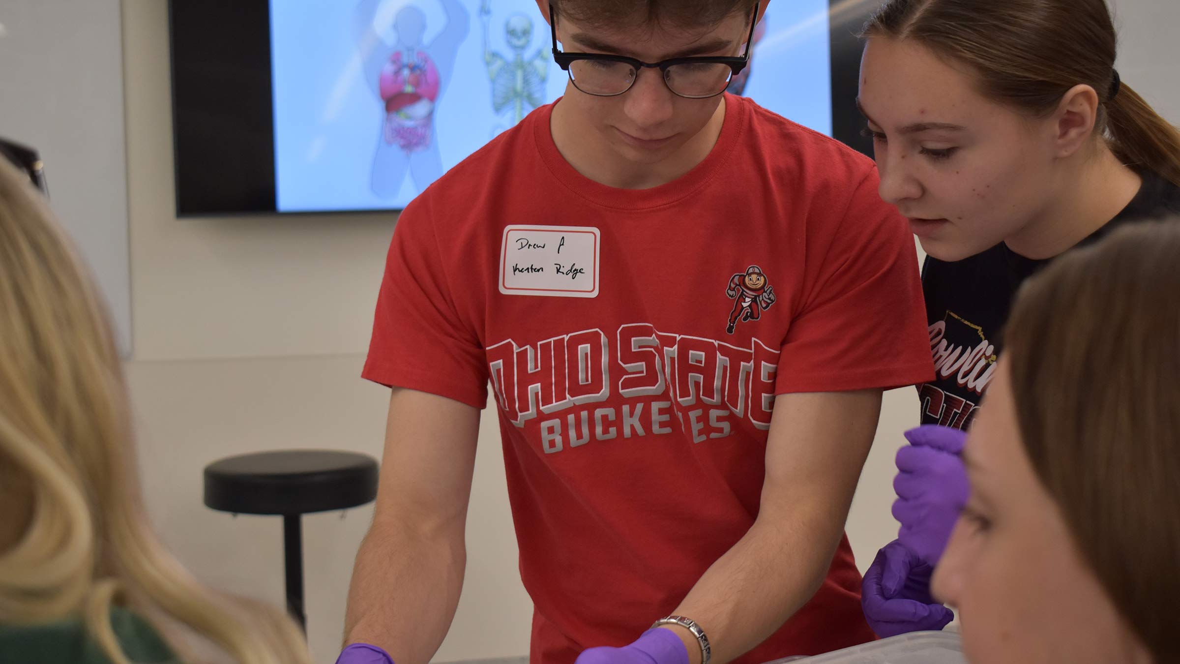 Drew Fansler and other students at one of the stations at the anatomy lab