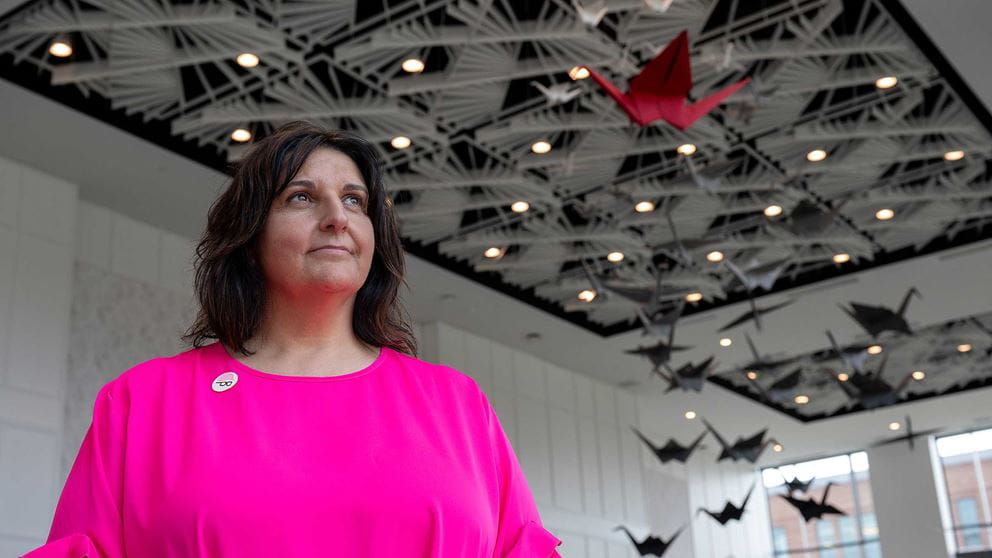 Kim Bader speaking at a public event raising awareness about mental health