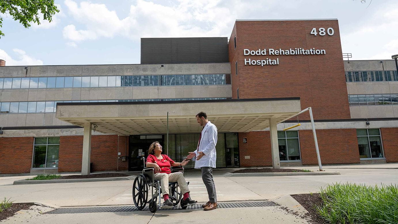 Dr. Hake and a patient talking outside Dodd Rehabilitation Hospital