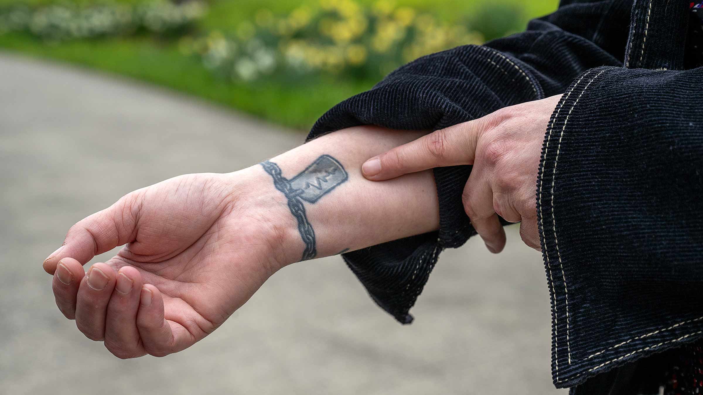Michelle Wessel’s charm bracelet tattoo on her wrist 
