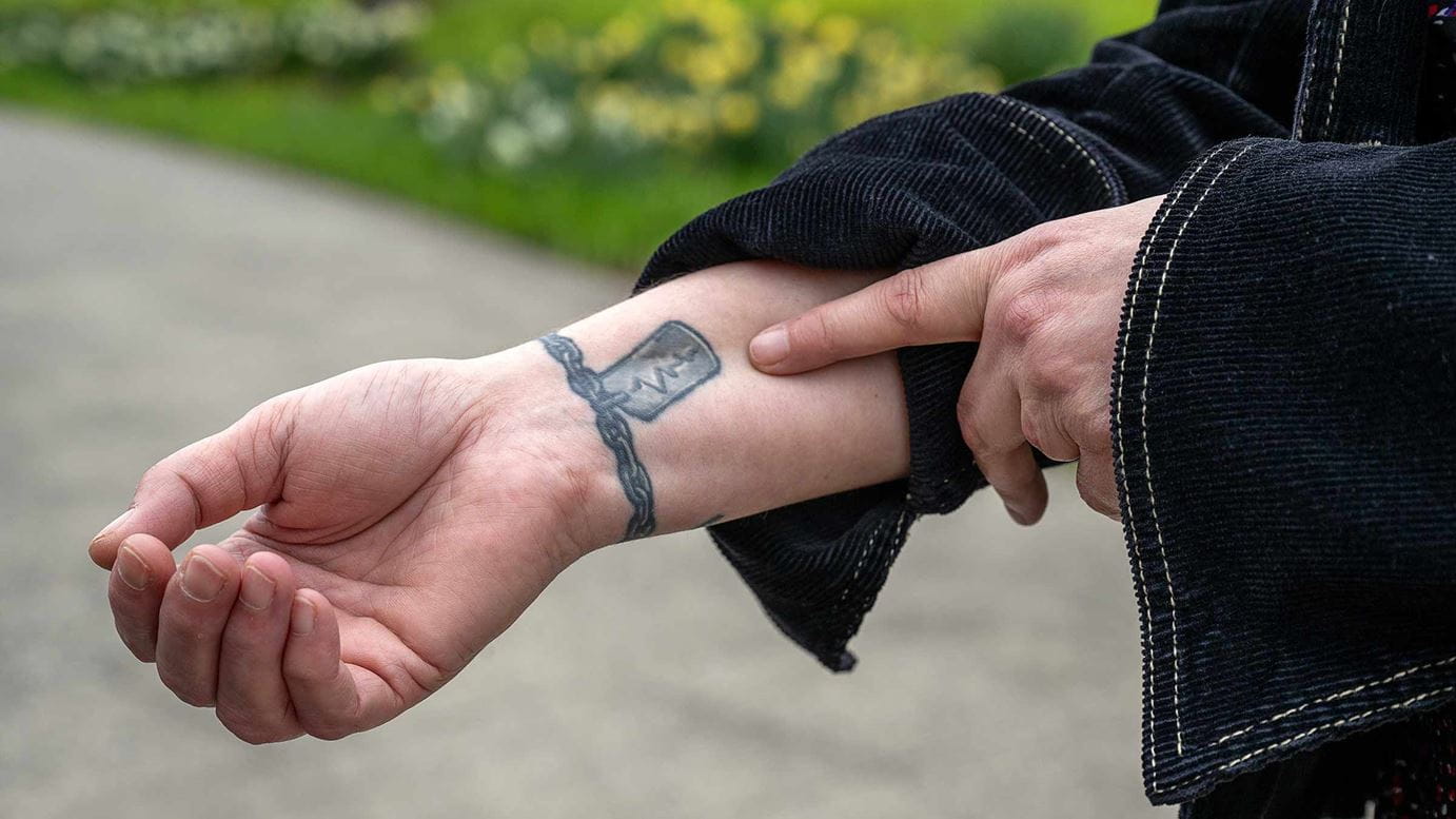 Michelle Wessel’s charm bracelet tattoo on her wrist 