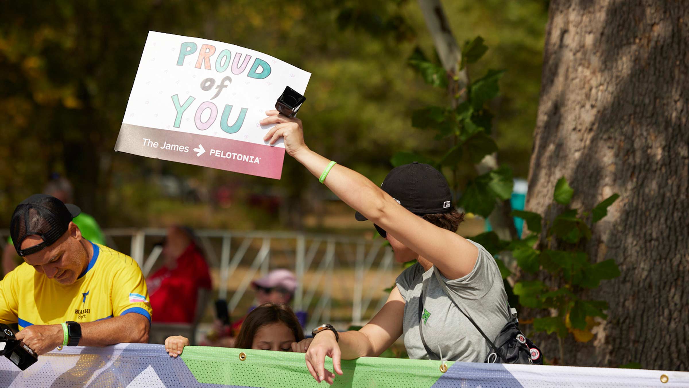 A fan holding a sign: "Proud of You"