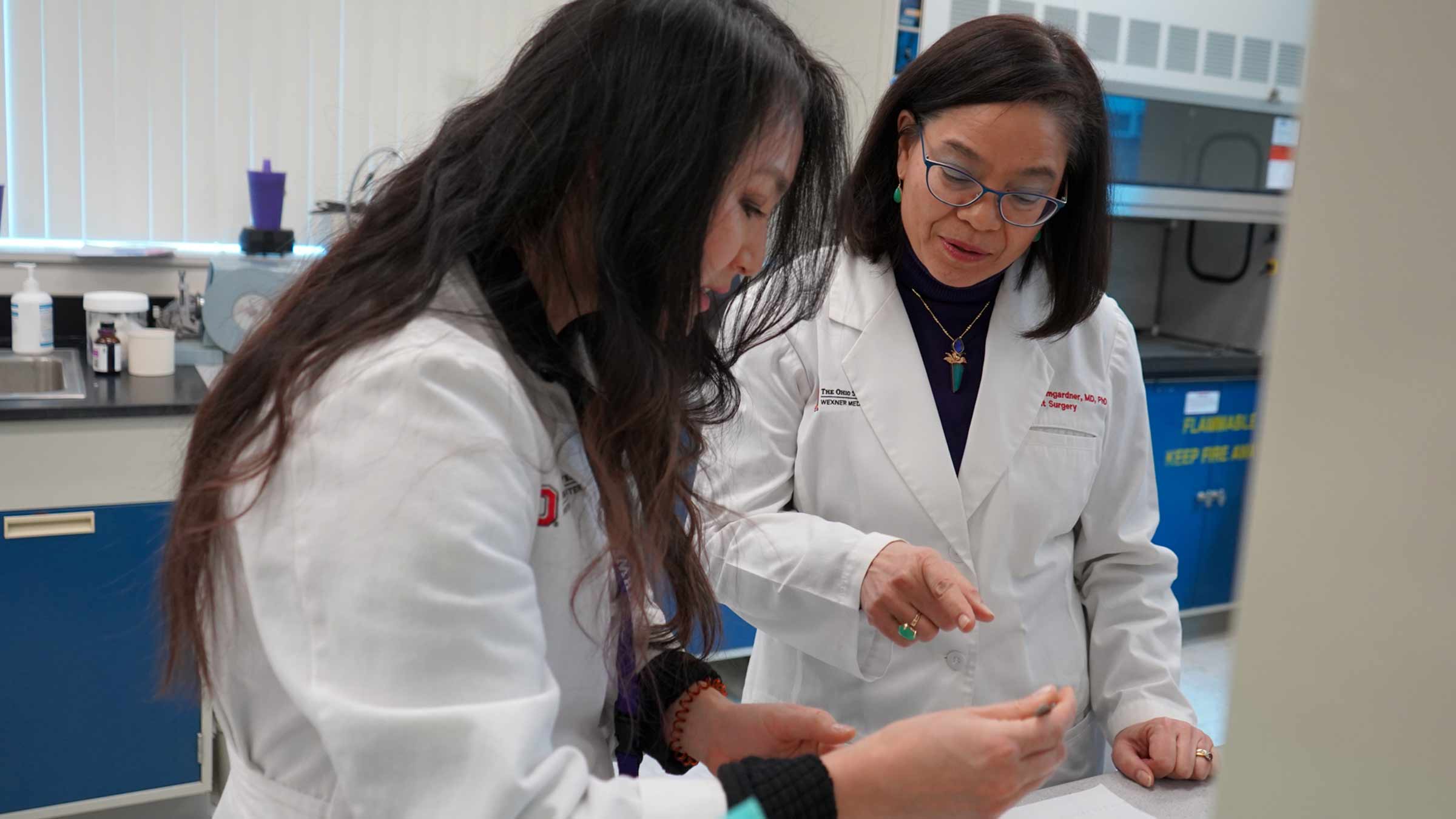 Dr. Ginny Bumgardner working alongside a colleague in a research lab