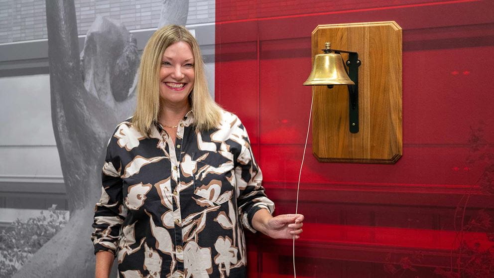 Julia DeVillers ringing the bell