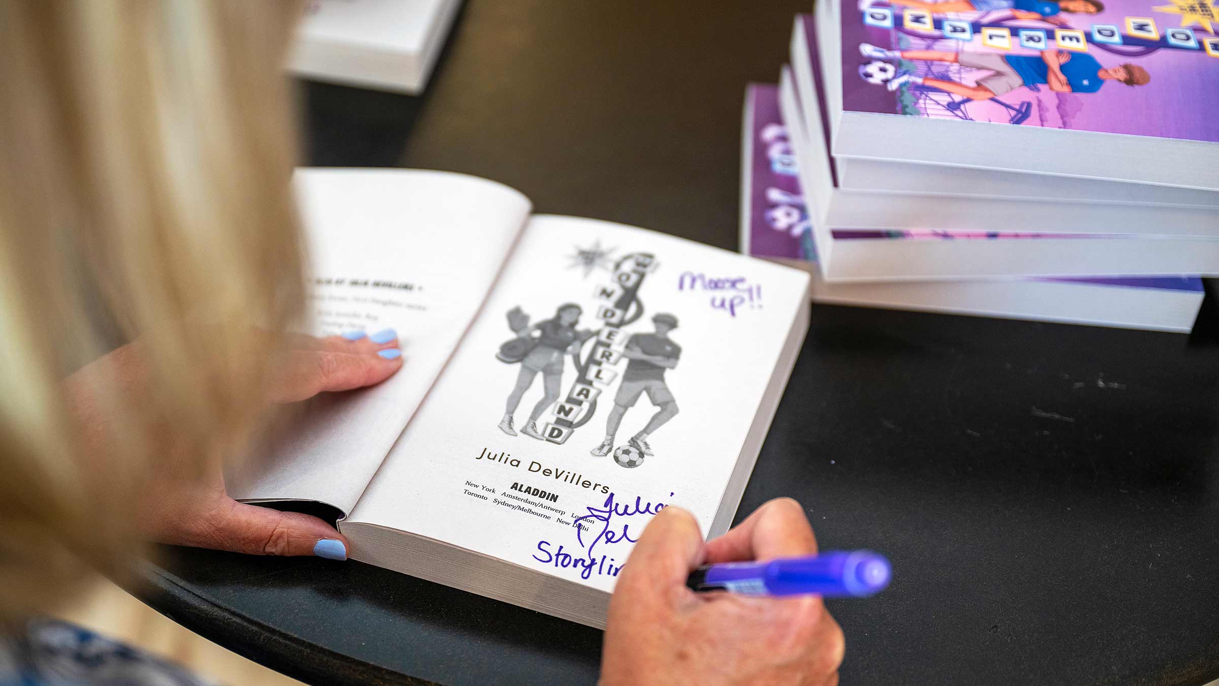 Julia DeVillers signing her book