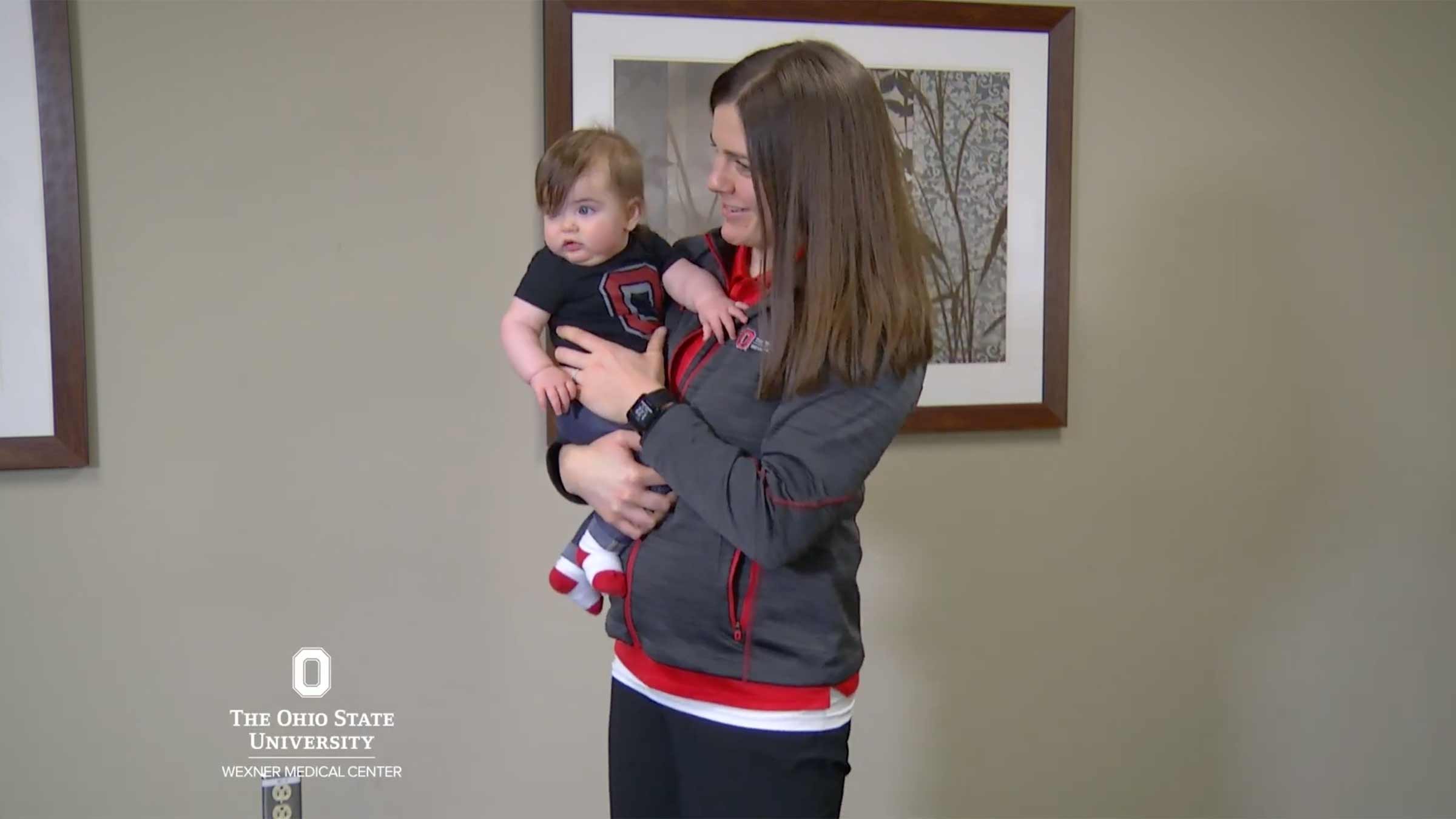 Ohio State physical therapist showing how to hold a baby