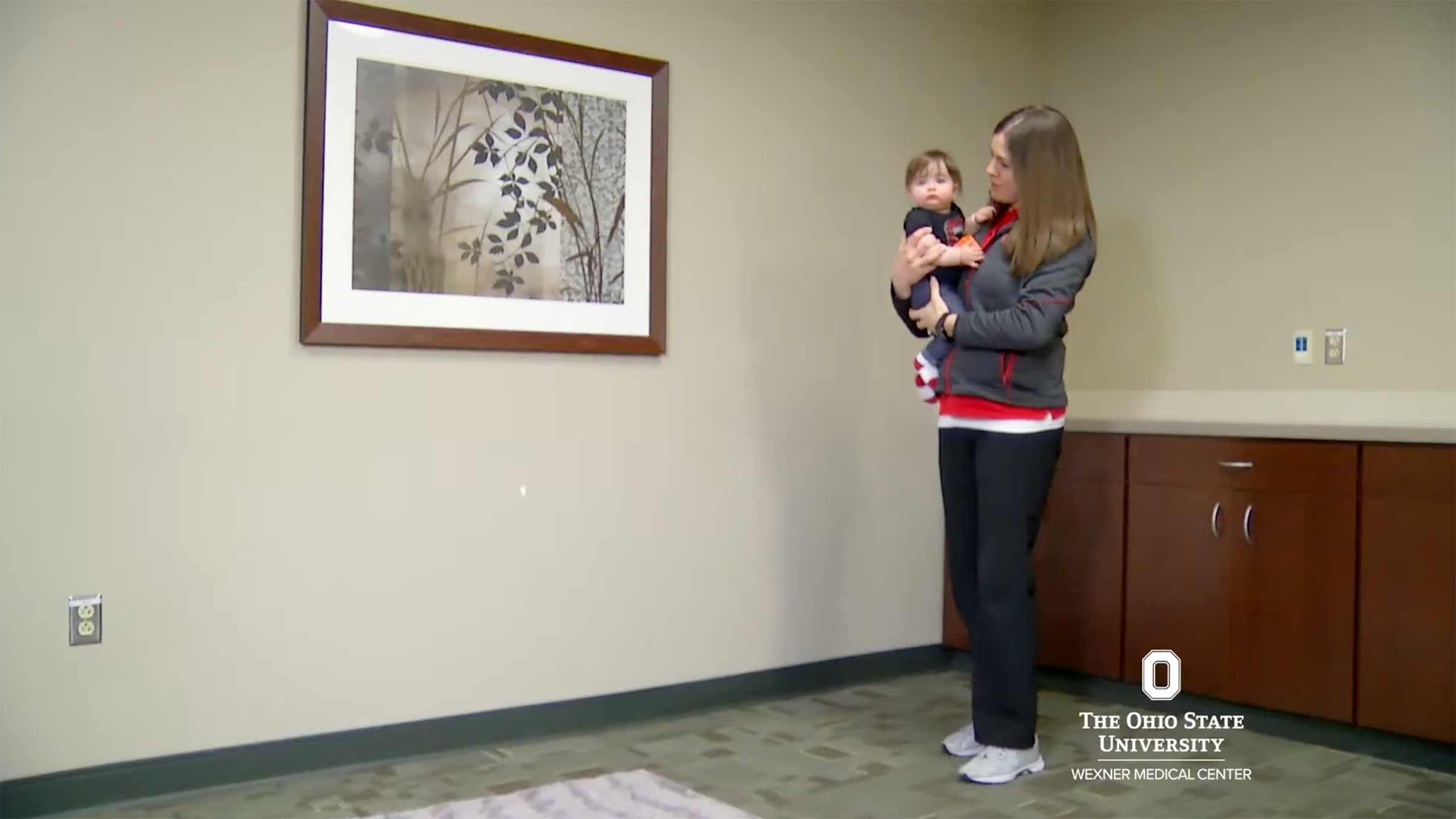 Ohio State physical therapist holding a baby