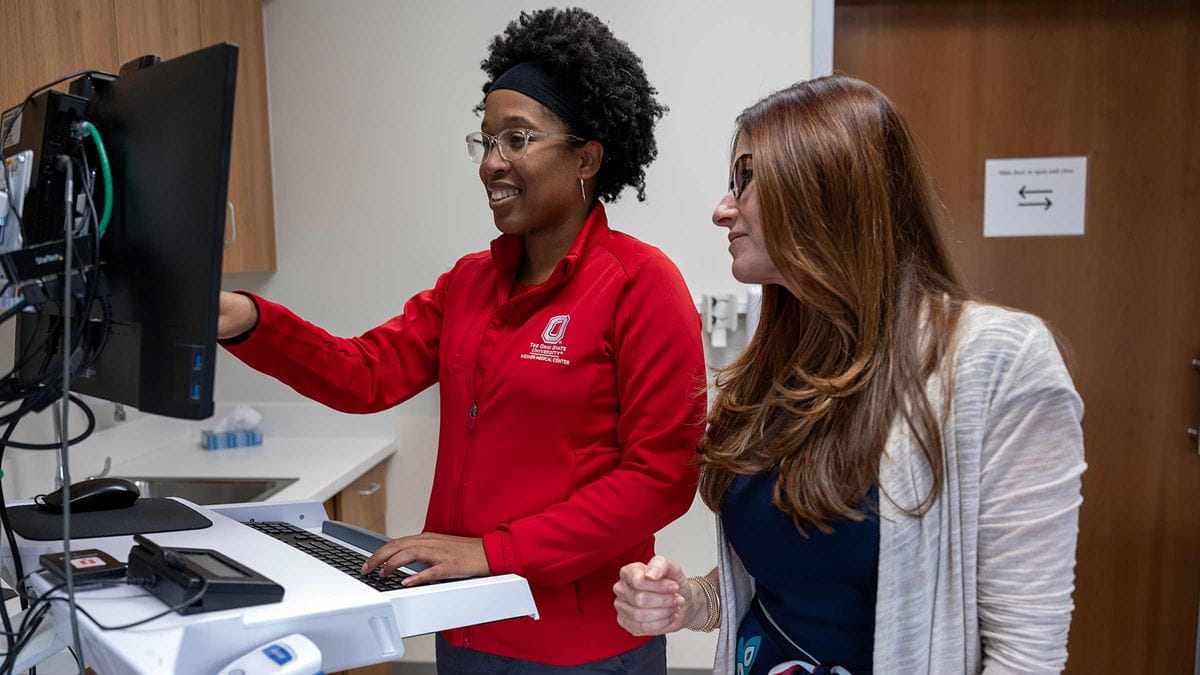 Dr. Becker with a colleague looking at the computer screen