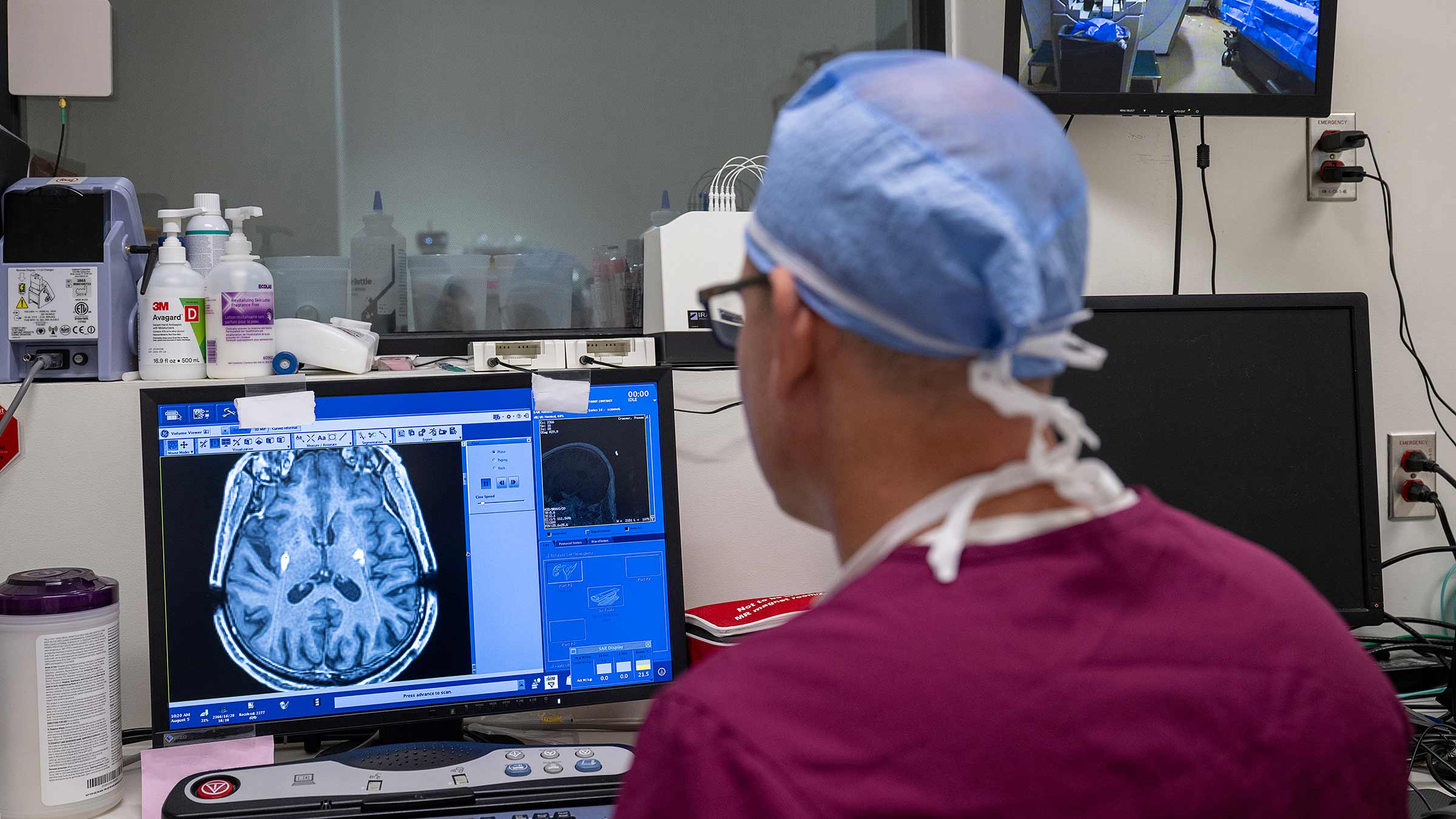 Dr. Elder looking at a scan on a computer screen