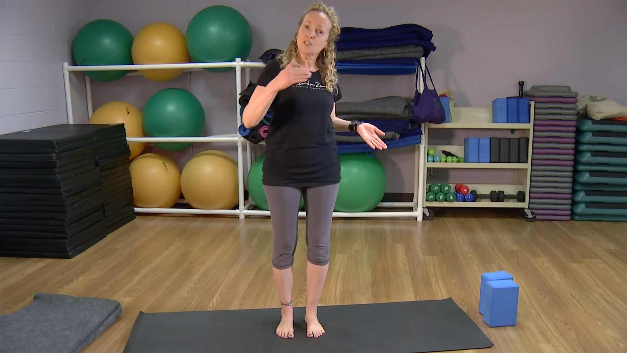 Yoga instructor showing how to do a standing pose