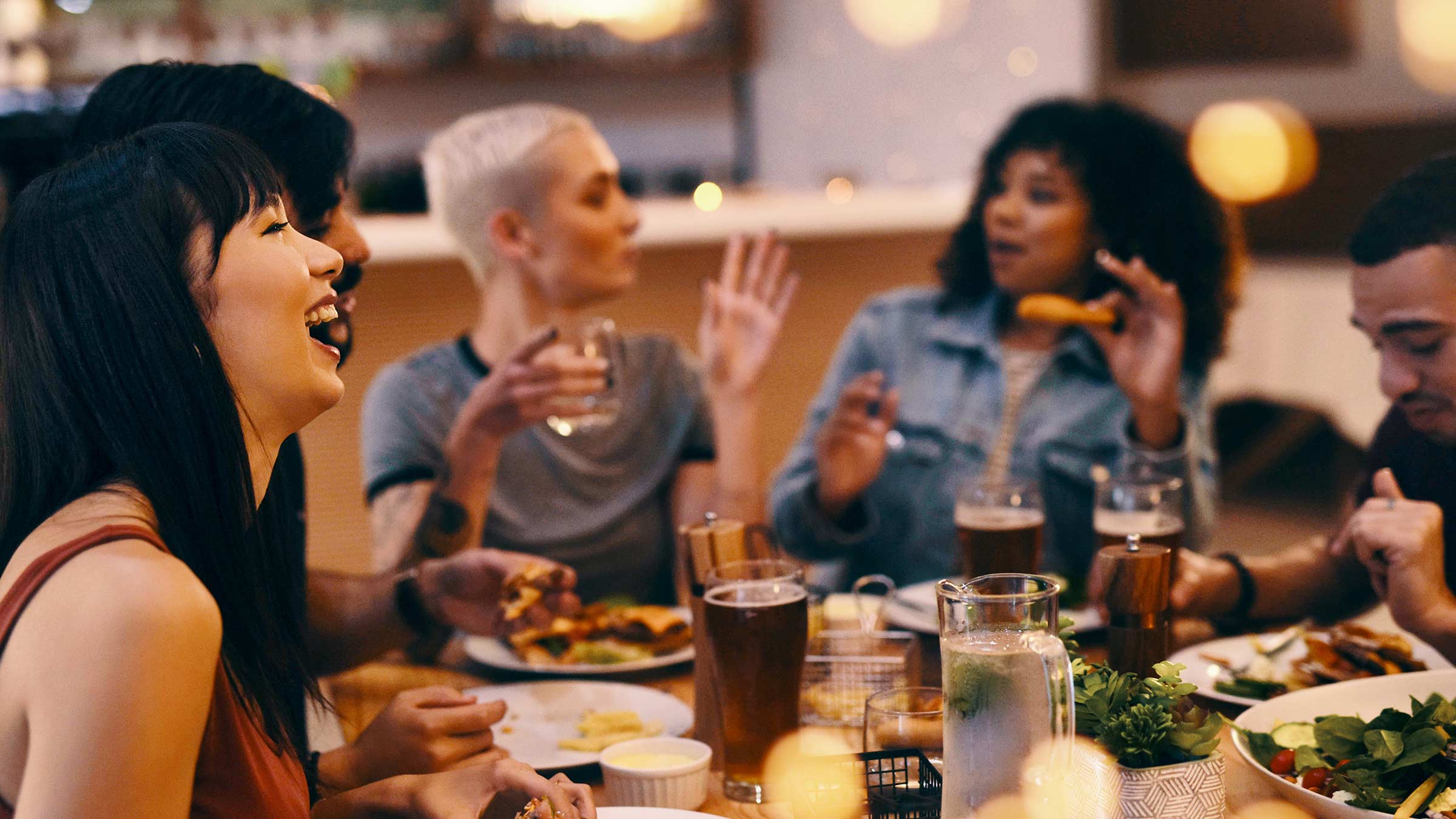 Friends enjoying a meal together at a restaurant