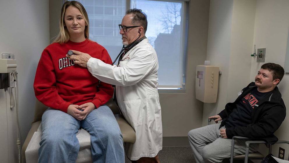Dr. Daniels listening to Shayna Hemming’s heart