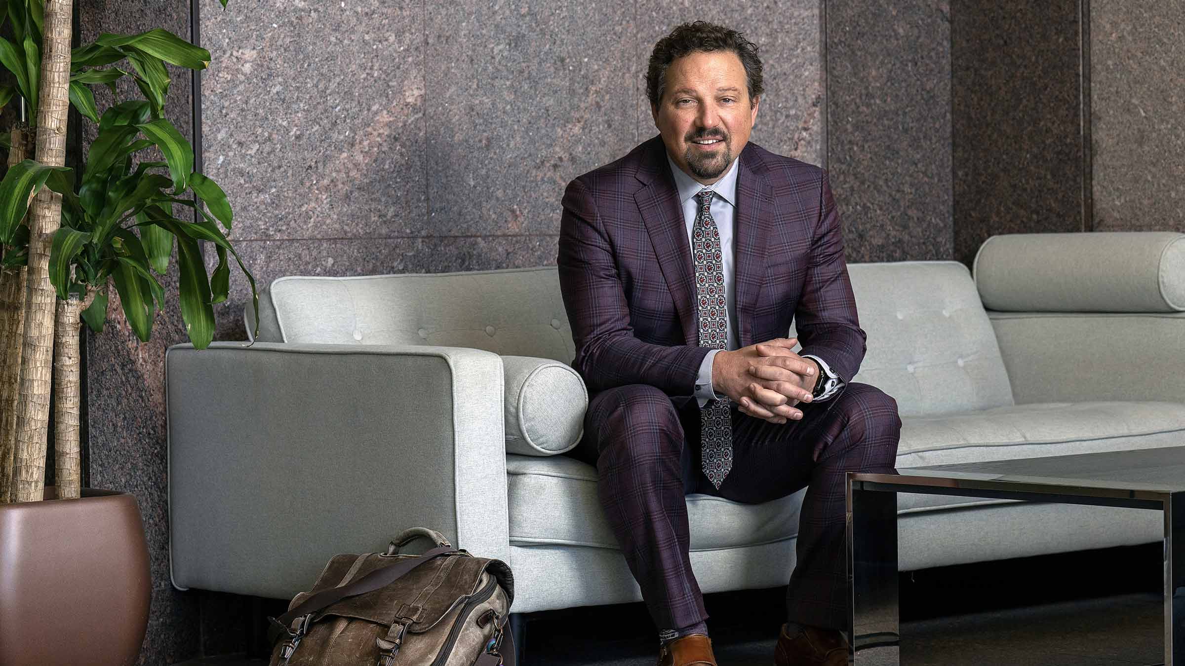 Scott Langenecker sitting on a sofa