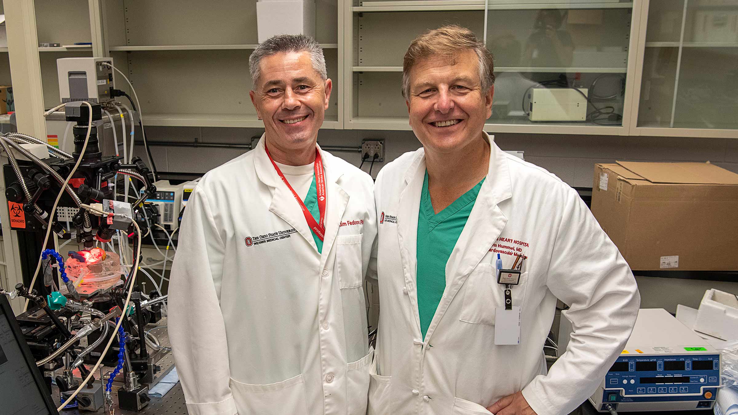 Vadim Fedorov and John Hummel in a lab 