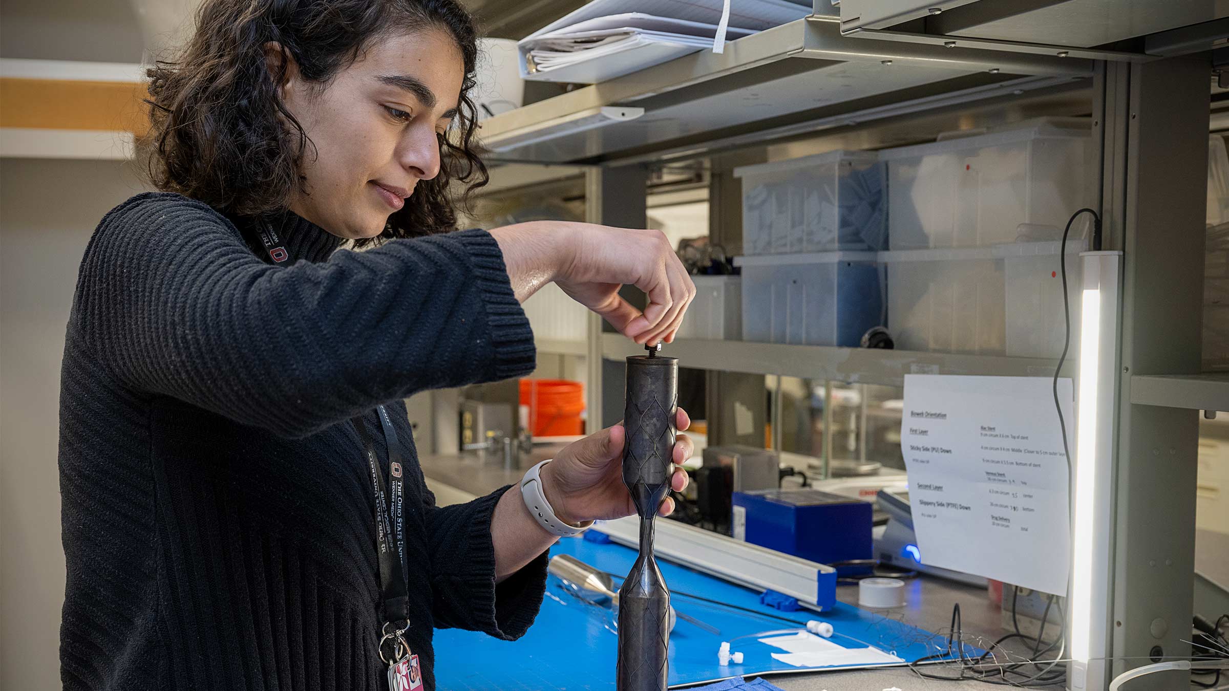 After the stent is assembled, it’s placed on a steel spindle called a mandrel, which is designed to shape the stent to the unique dumbbell design created by Bryan Tillman, MD, PhD.
