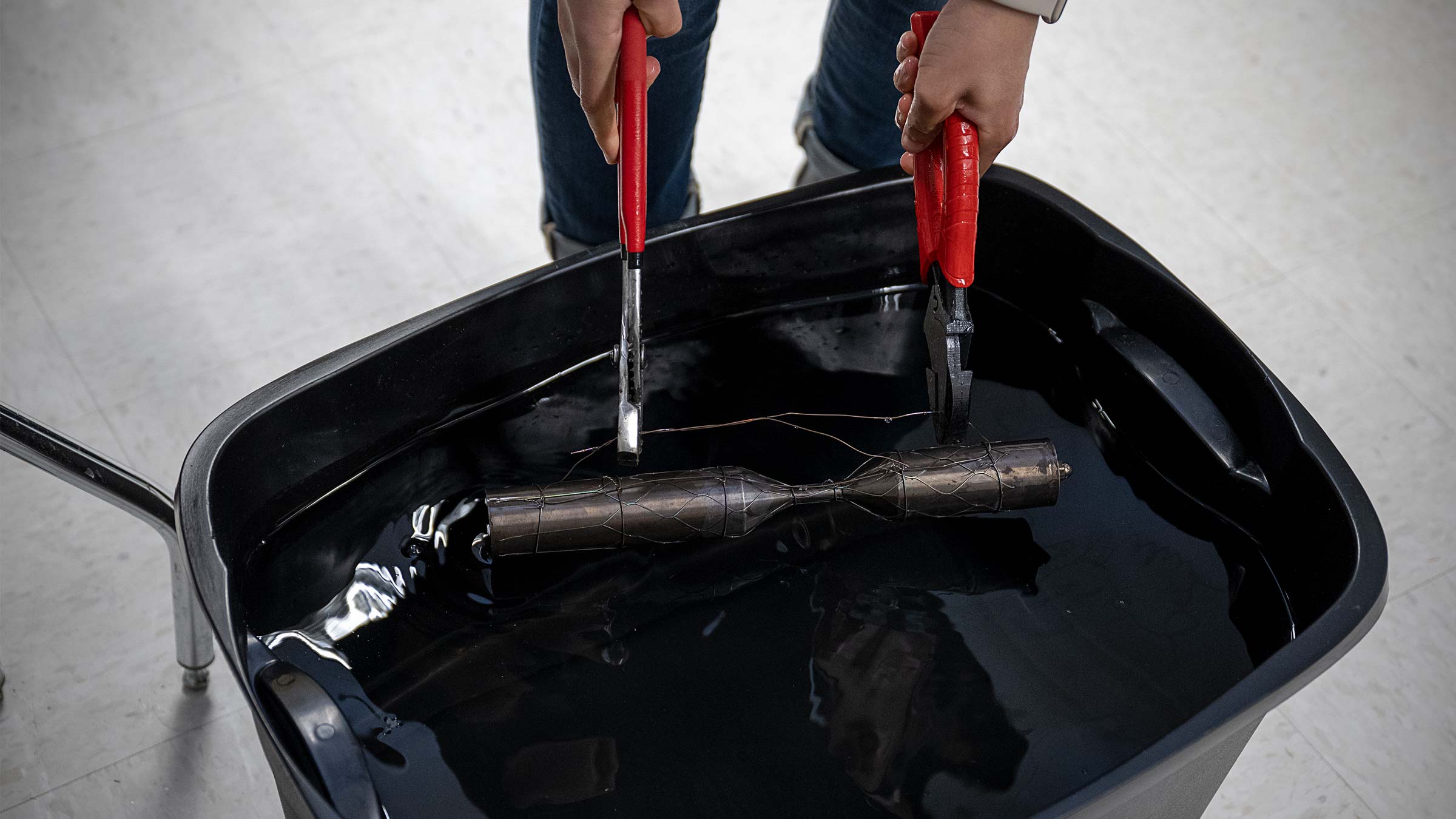 The shaped stent is superheated in a furnace, then dunked in water to rapidly cool and set the shape.