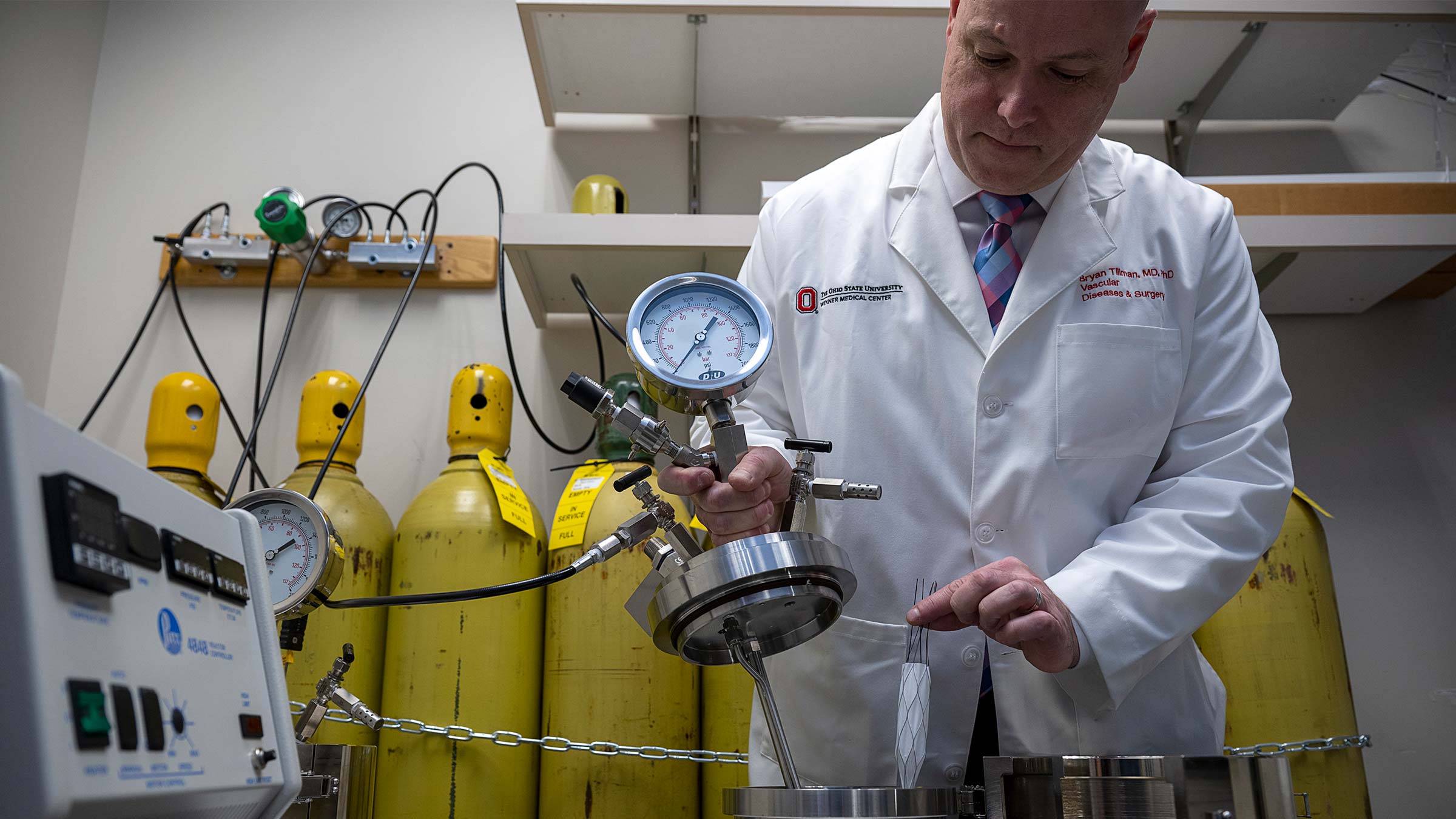 In the final step of creating the rescue stent, Dr. Tillman places the stent in a pressurized tank to seal the plastic casing on the outside of the stent.