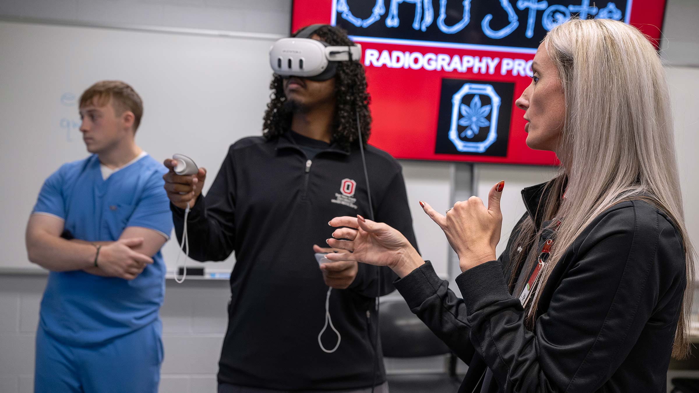 Student using virtual reality headset with instructor support