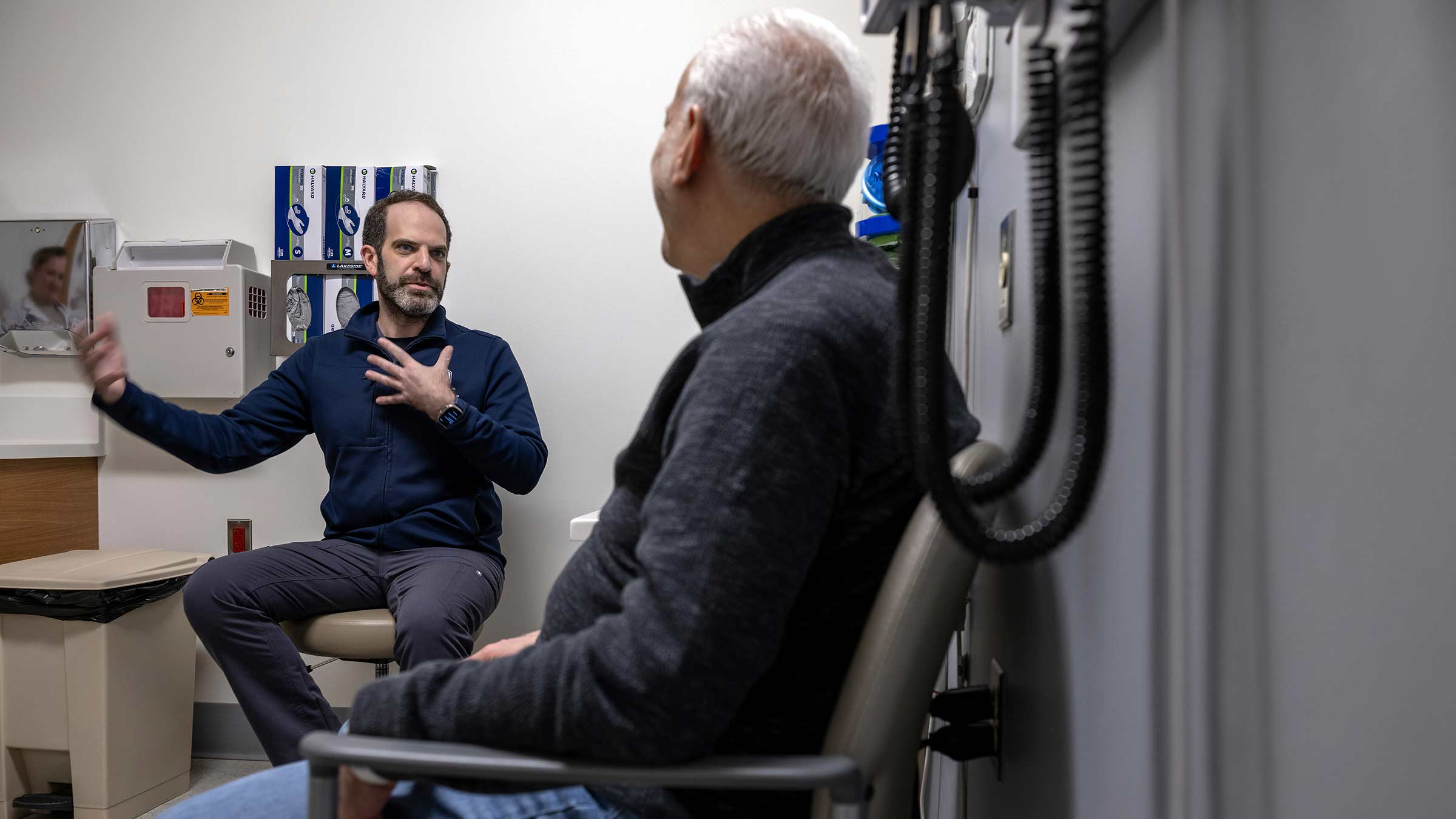 Radiologist Jeremy Brownstein talking to the patient Jim DiCostanzo