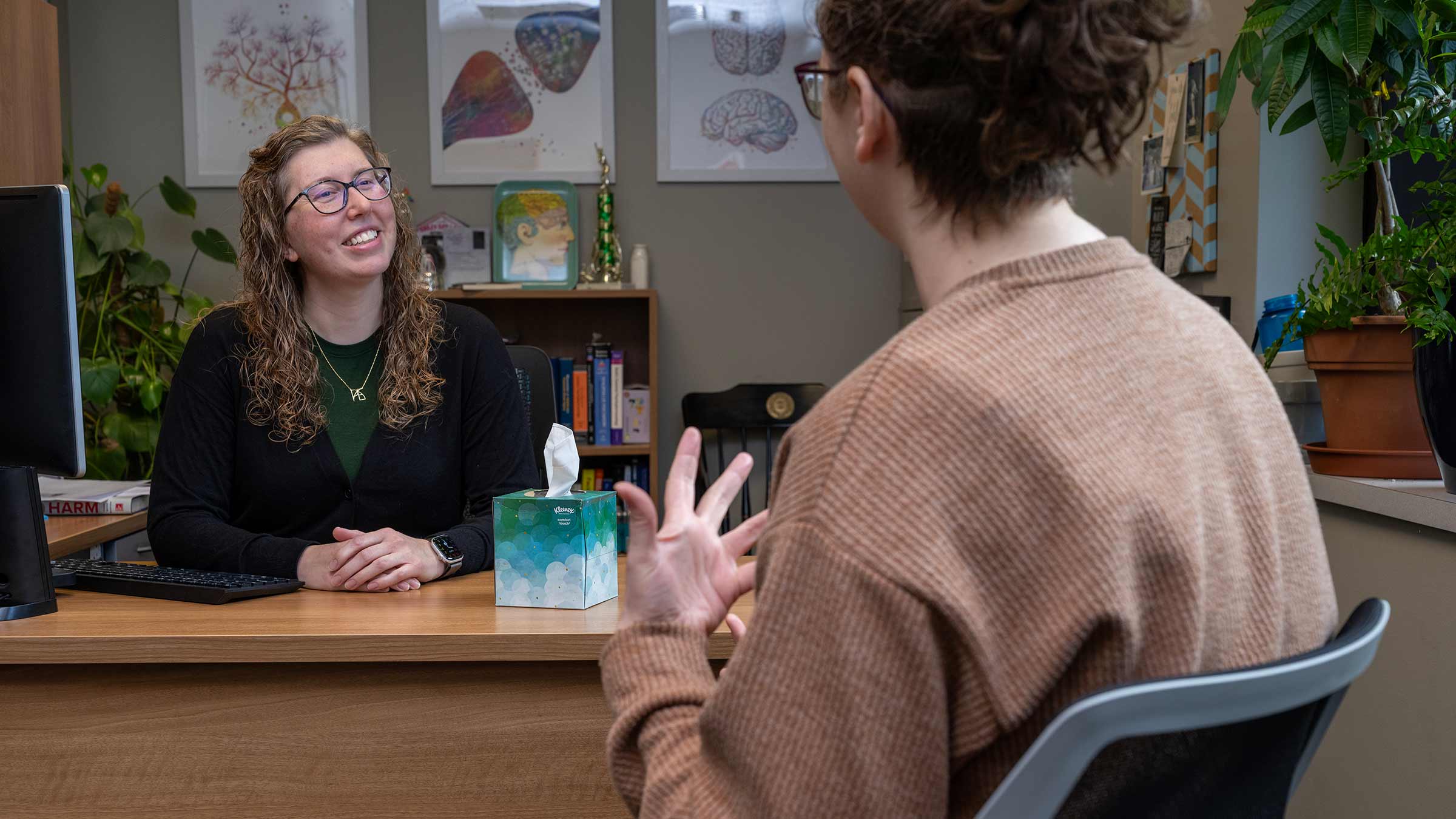 Katherine Brownlowe, MD speaking with a colleague