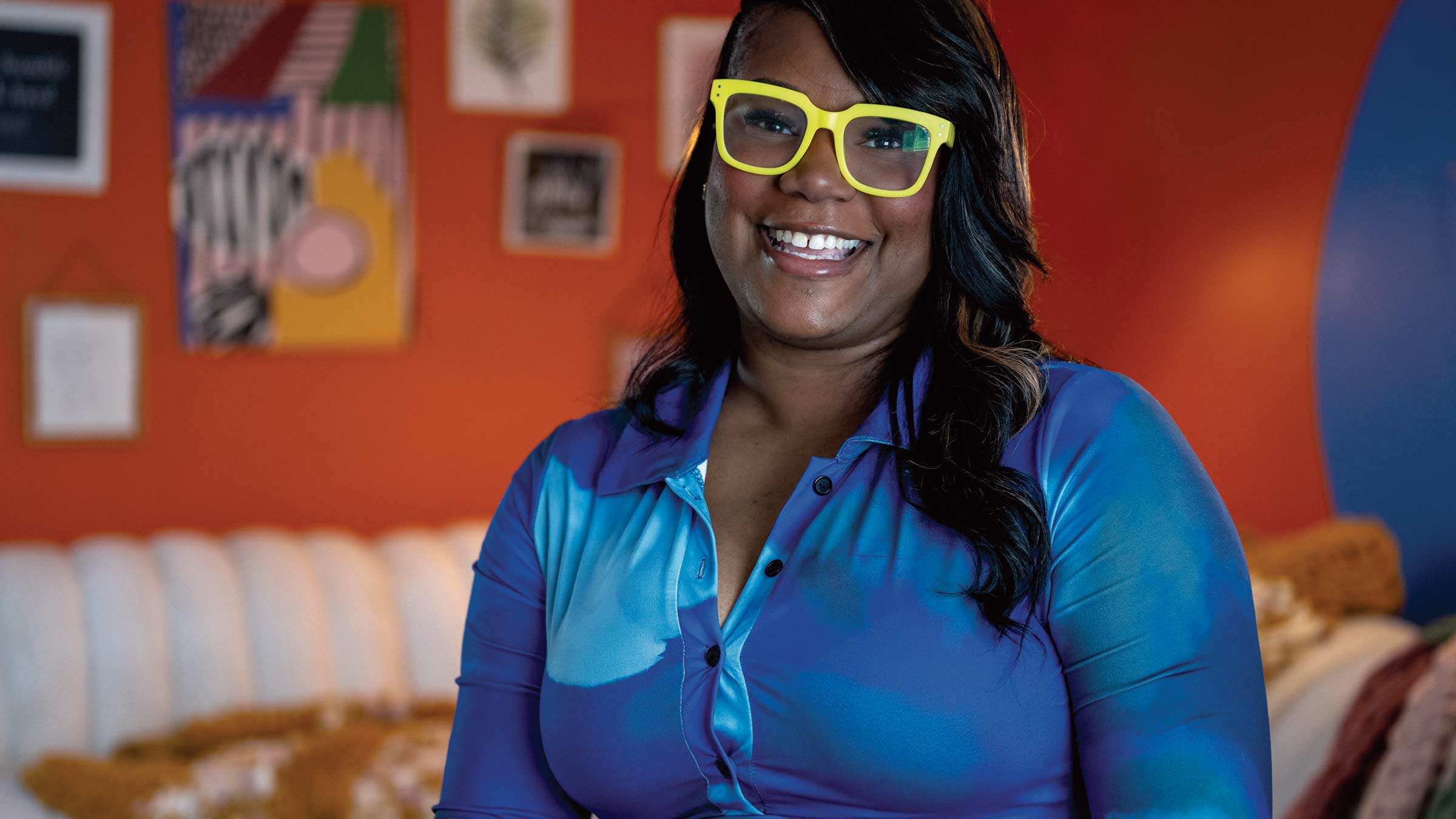 NaAsiaha Simon smiling in her home