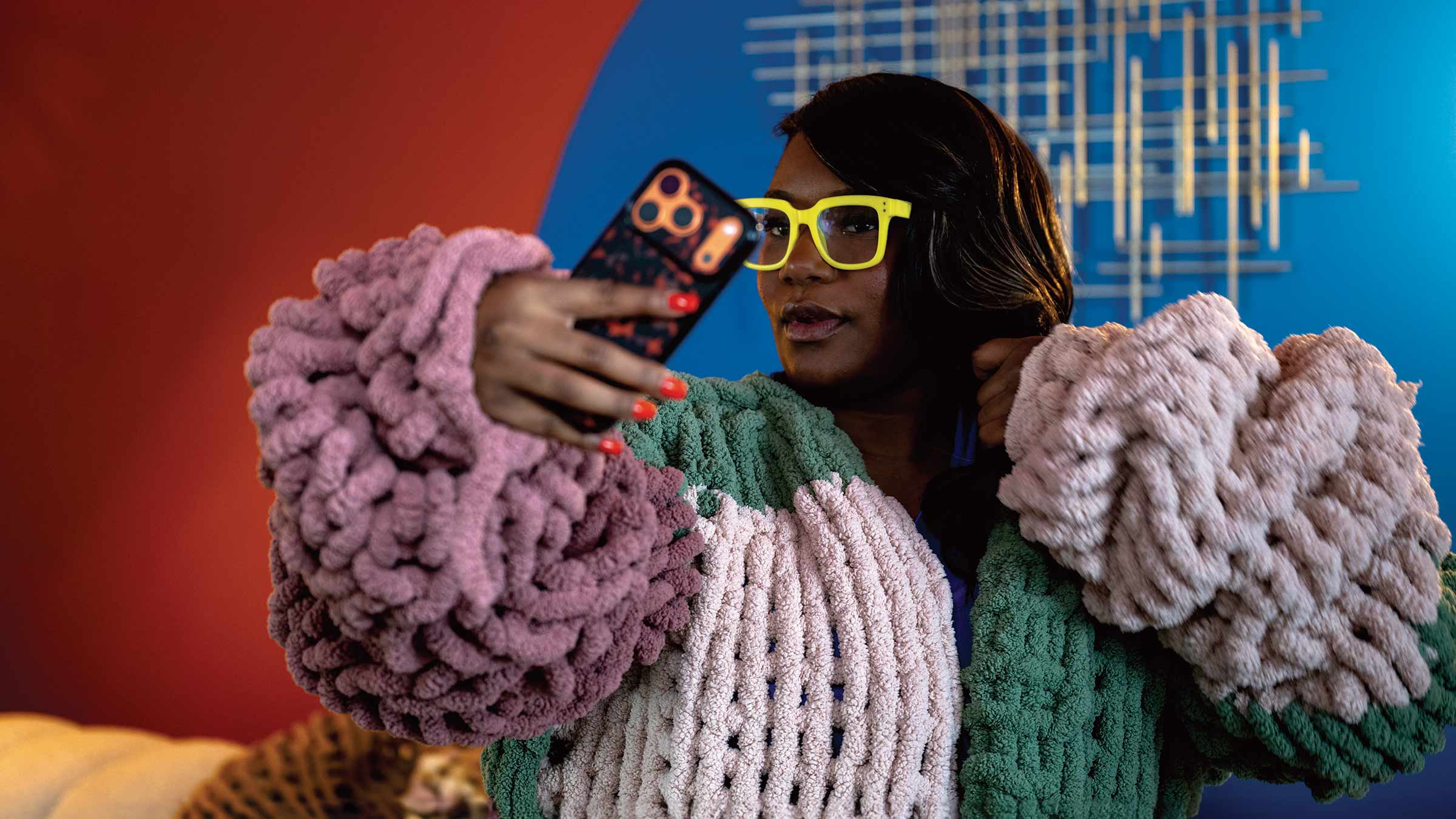 NaAsiaha Simon takes a selfie while wearing bright yellow glasses