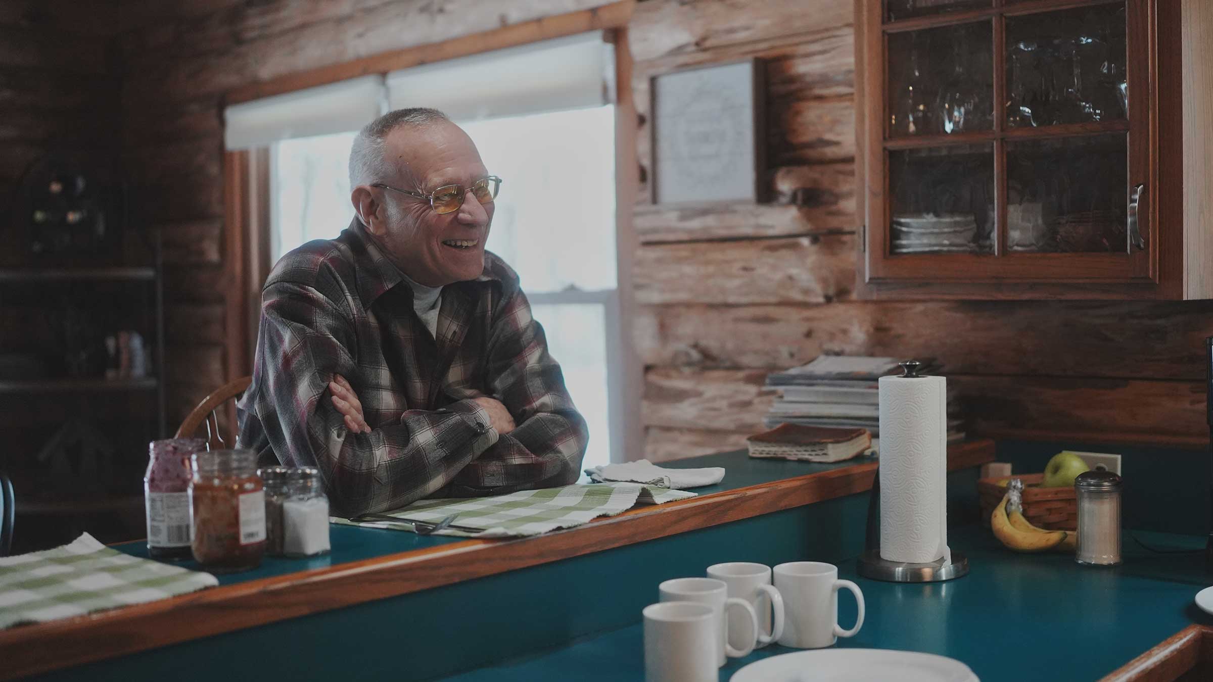 Tim Walker sitting at the counter in his kitchen