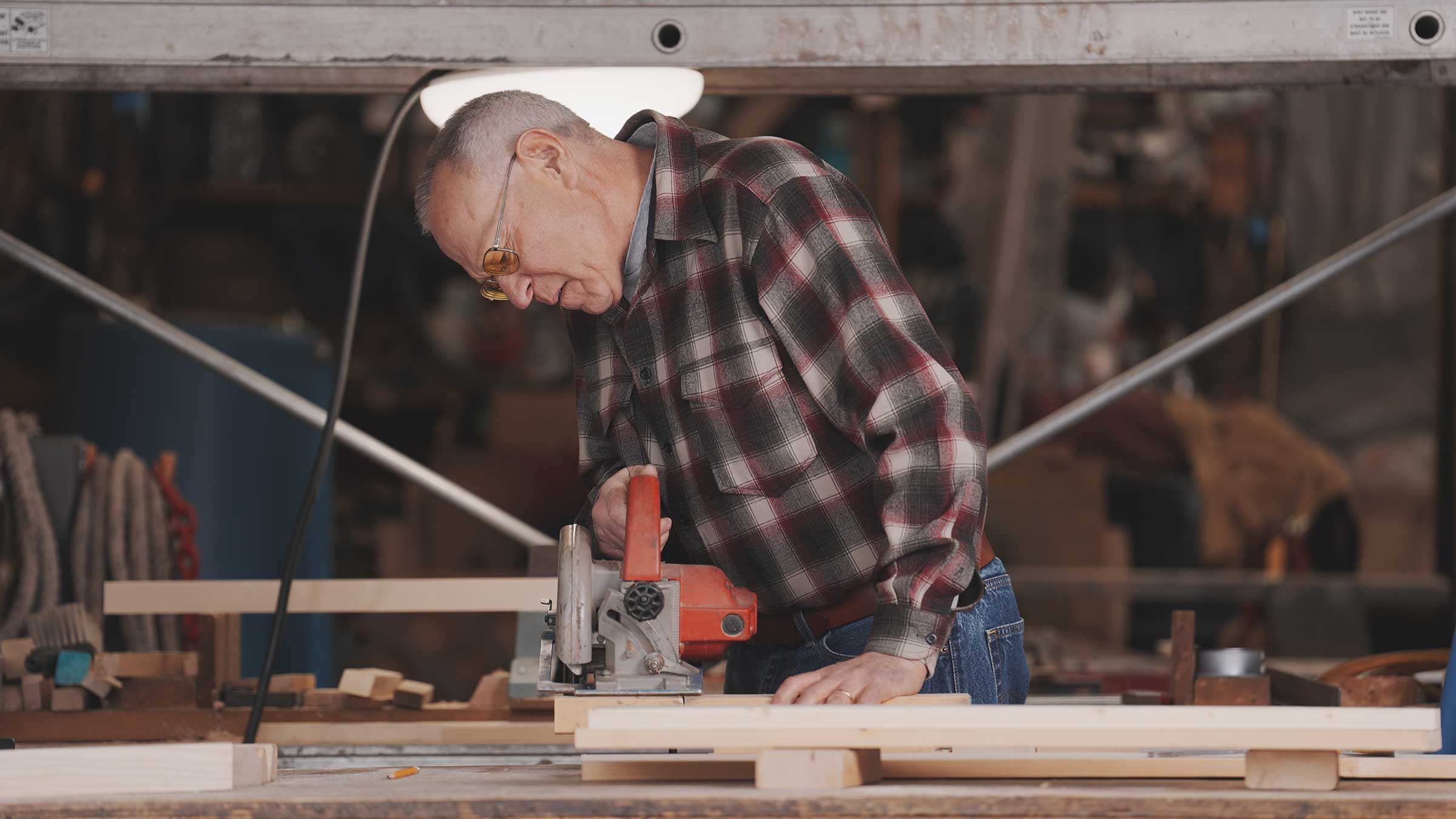 Tim Walker working in his wood shop at his home