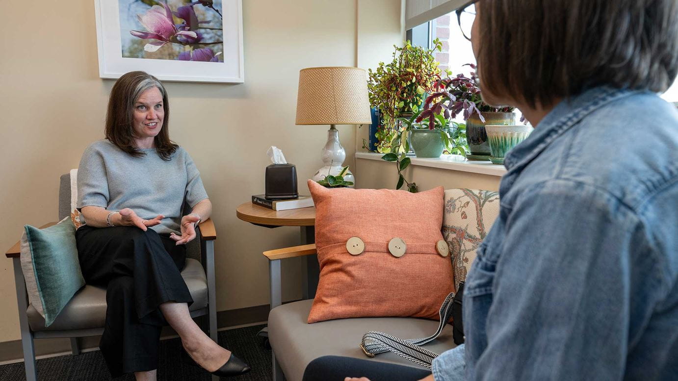 Dr. Carpenter in her office, talking