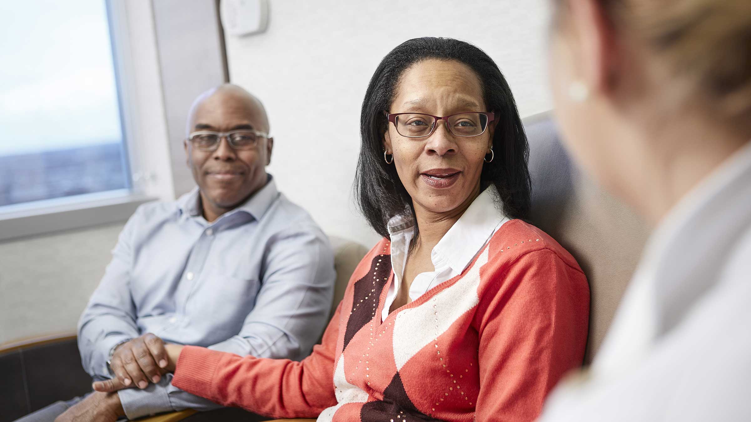 A Palliative care doctor having a consultation with a couple