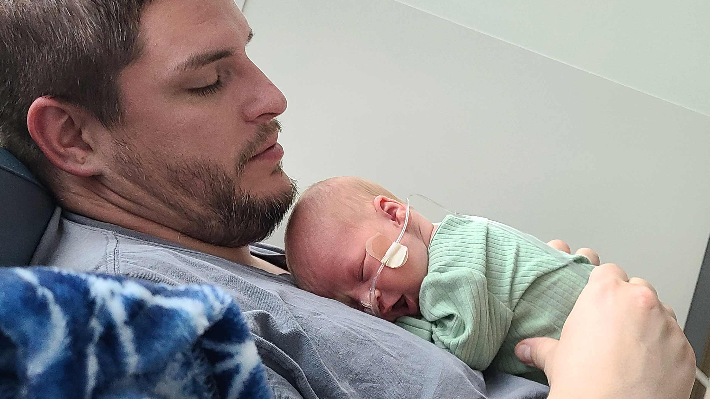 Nick Temple holding his newborn son, Isaiah, in the hospital