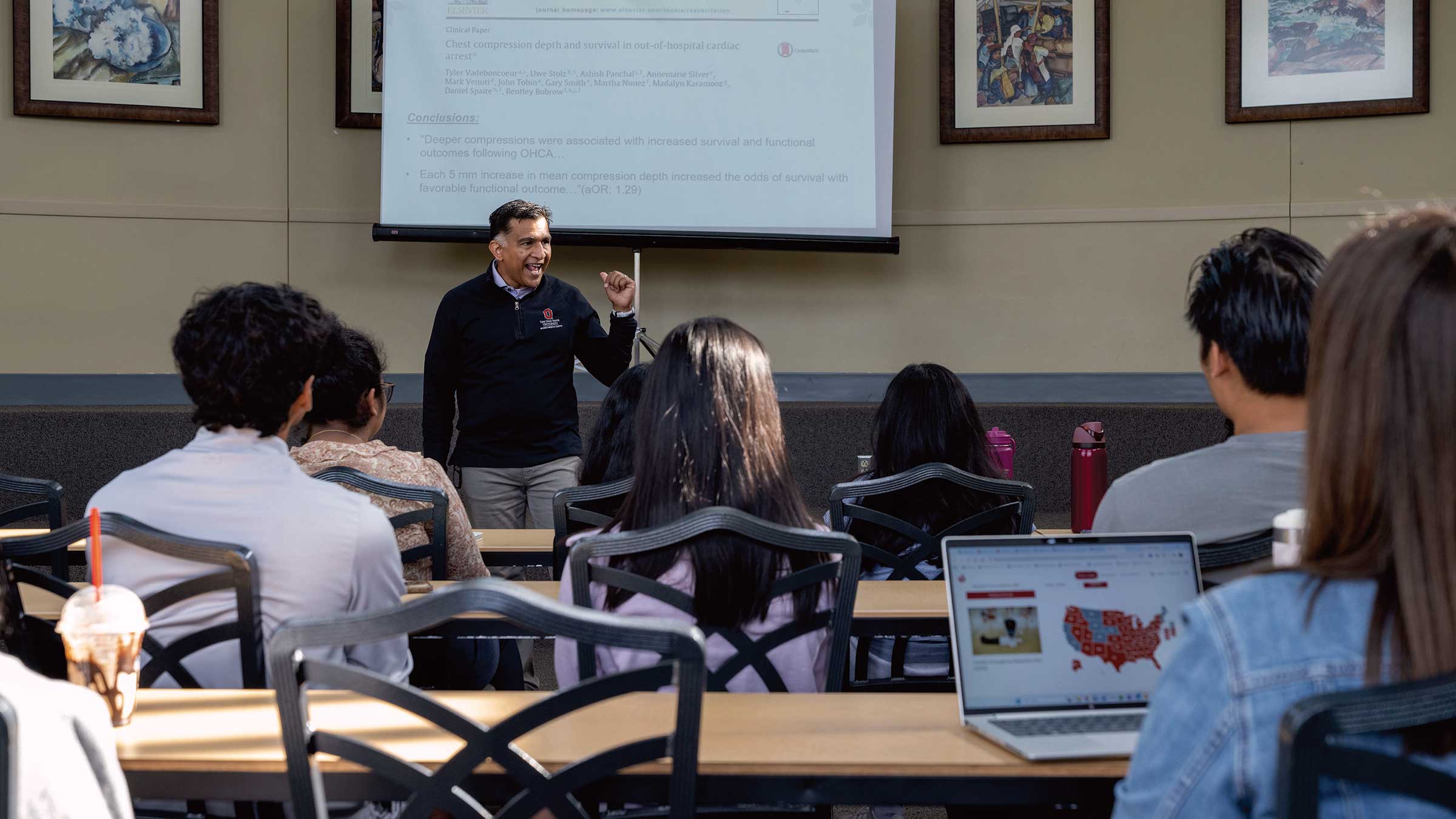 Dr. Ashish Pancha presents cardiac arrest data to a room full of medical students